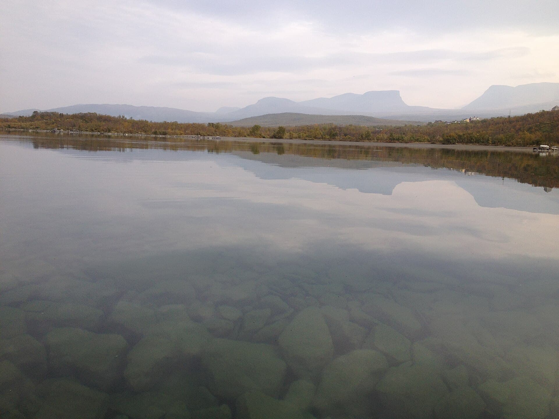 The glacial U-shaped trough of Lapporten rising above subarctic birch forest in Abisko National Park