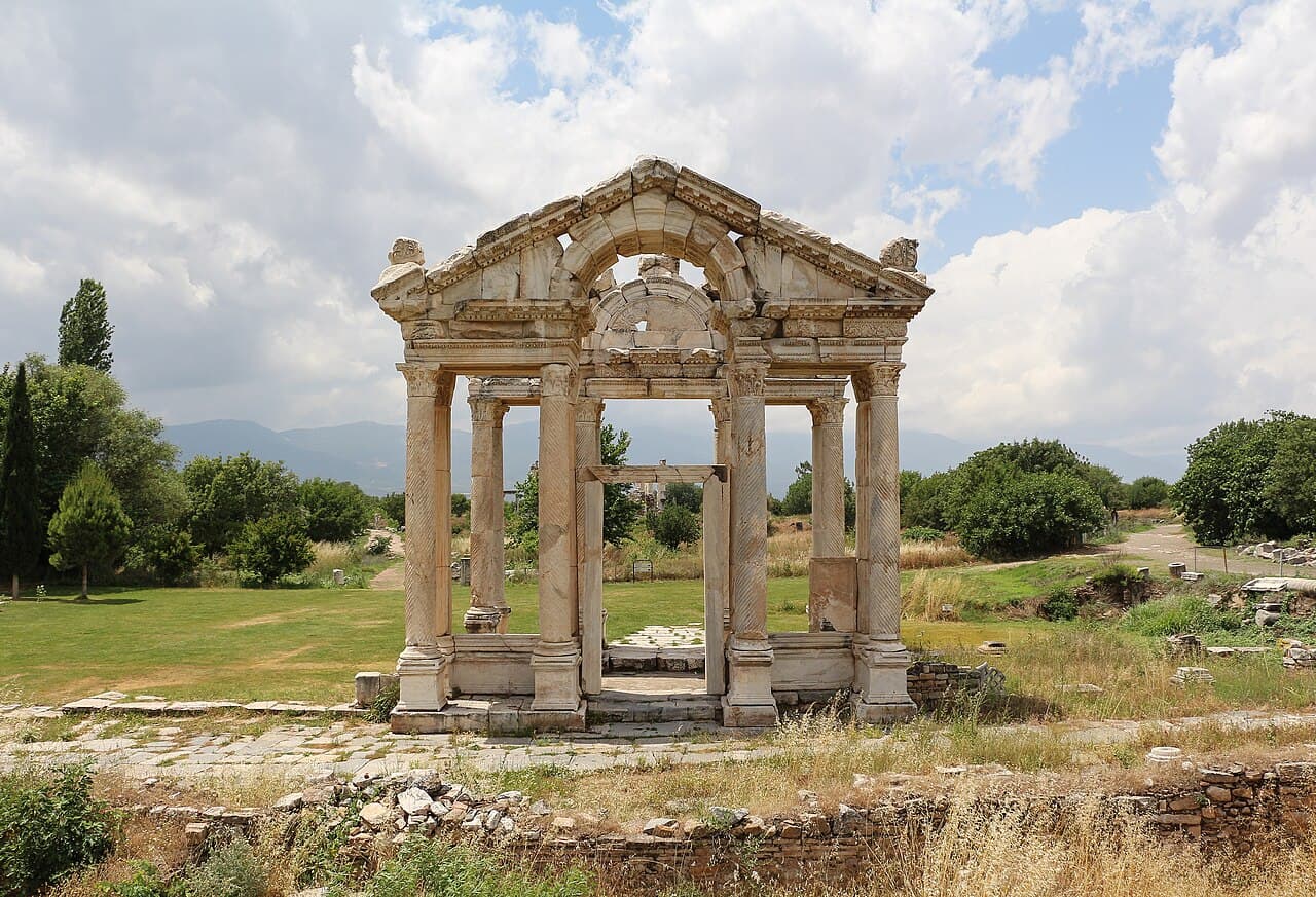Monumental marble Tetrapylon gateway and olive groves of ancient Aphrodisias near Geyre