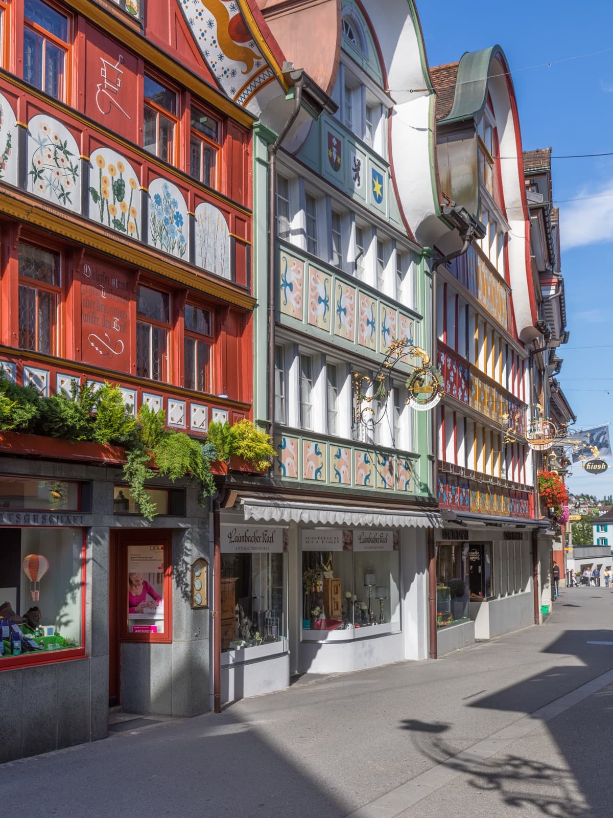 Painted wooden gables and historic townhouses along Hauptgasse in Appenzell