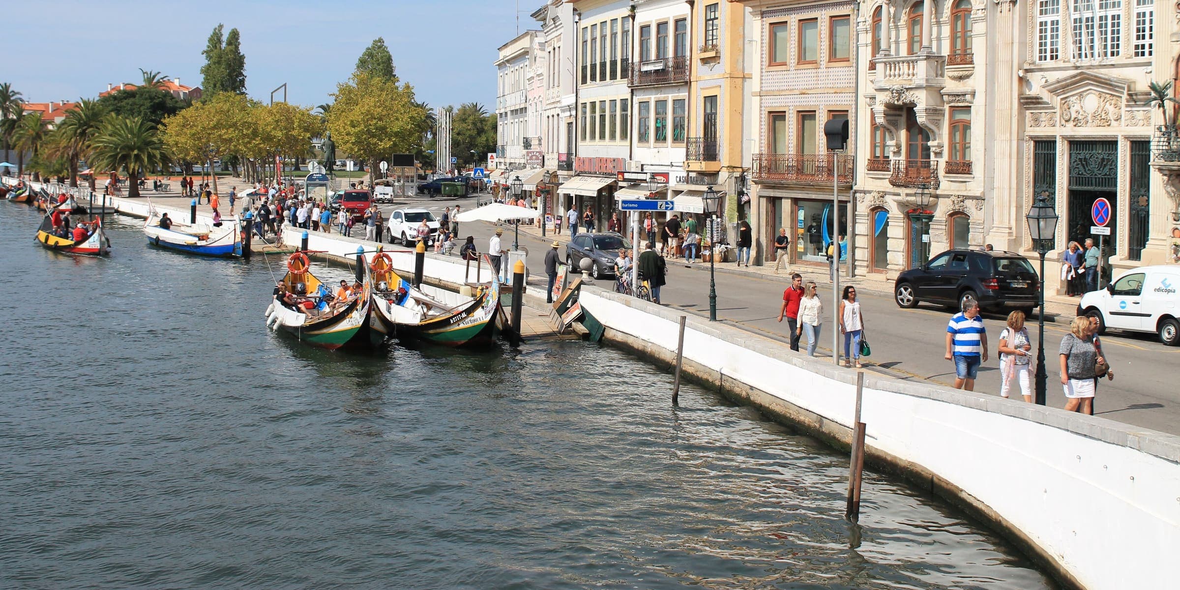 Painted moliceiro boats moored along the central canal in Aveiro
