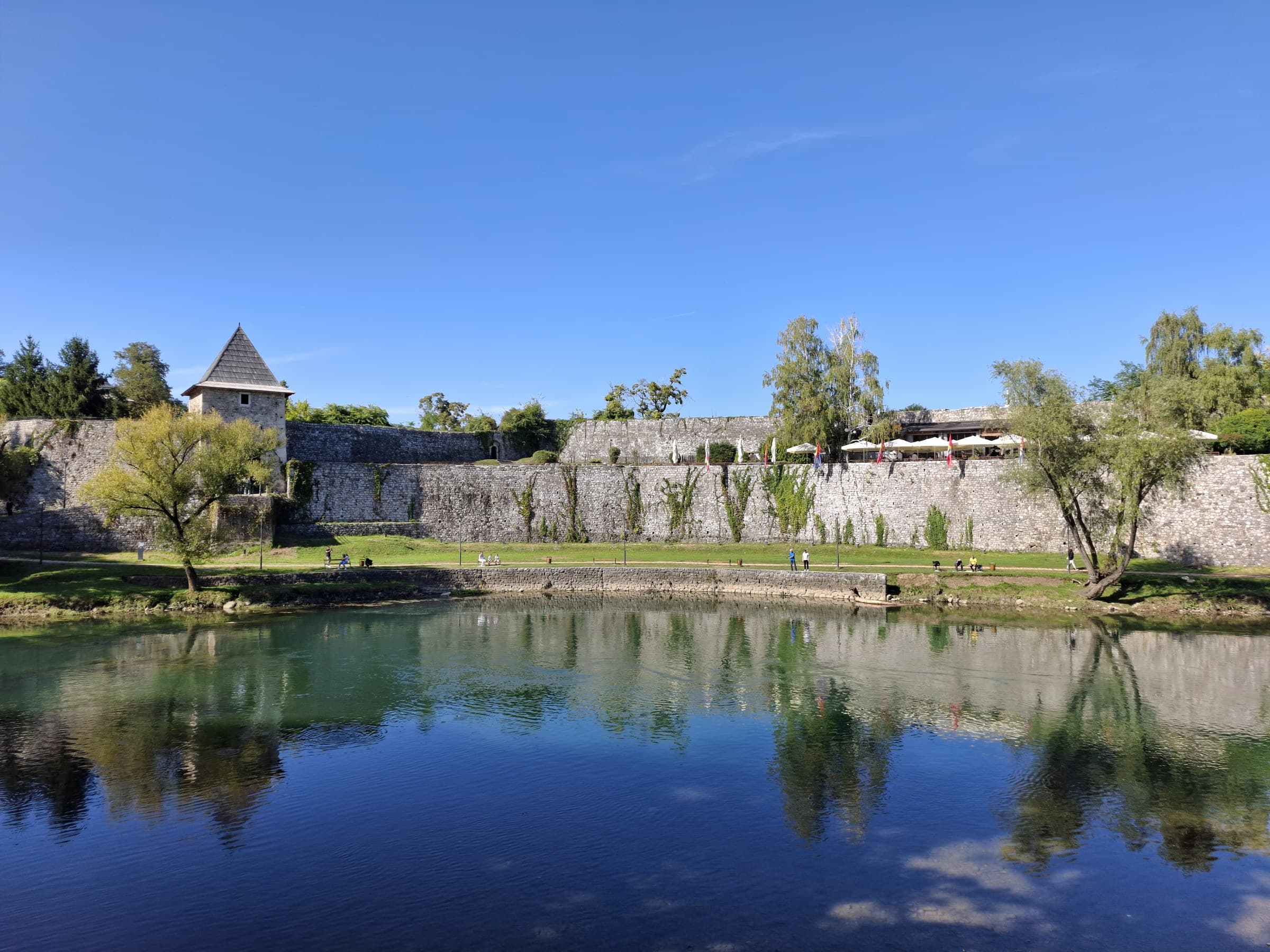 Ancient stone walls of Kastel Fortress built beside the green Vrbas River in Banja Luka