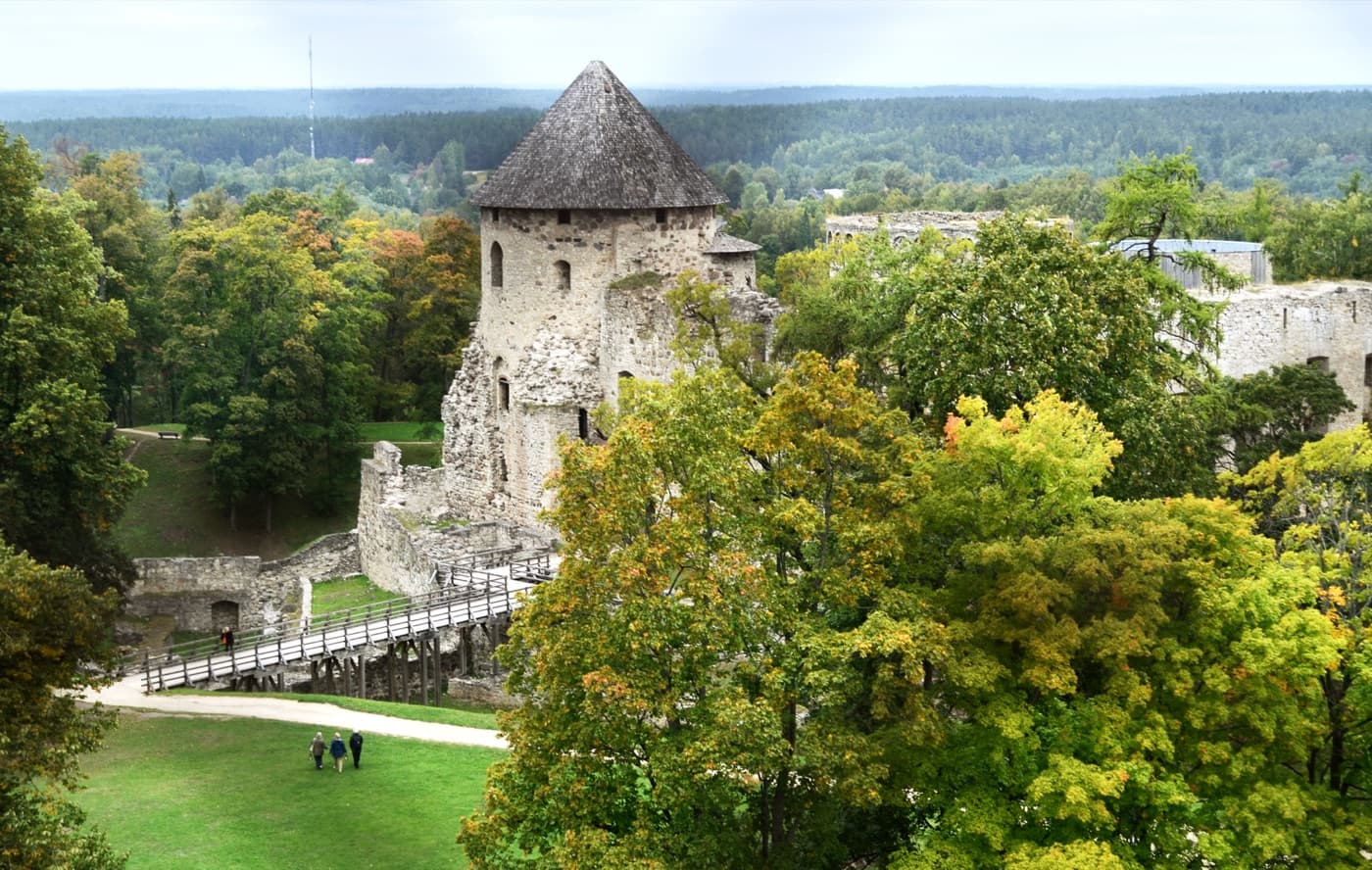 The formidable stone walls and defensive round towers of Cēsis Medieval Castle in Vidzeme