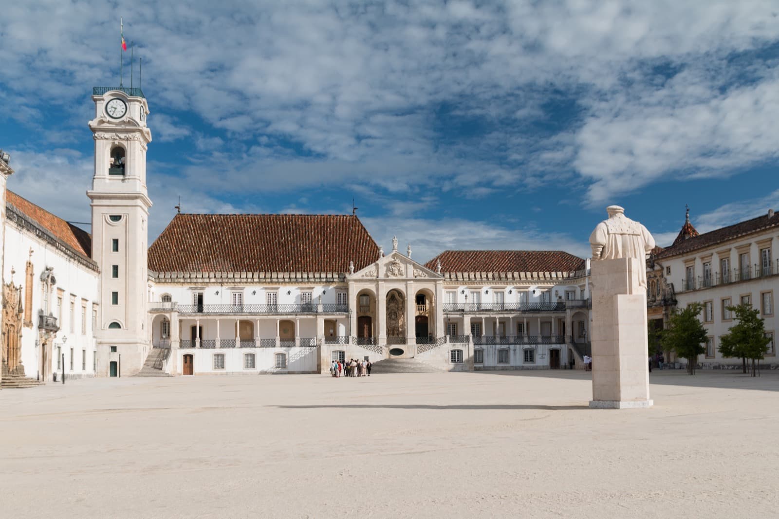 Historic courtyard and clock tower of the Paço das Escolas at the University of Coimbra