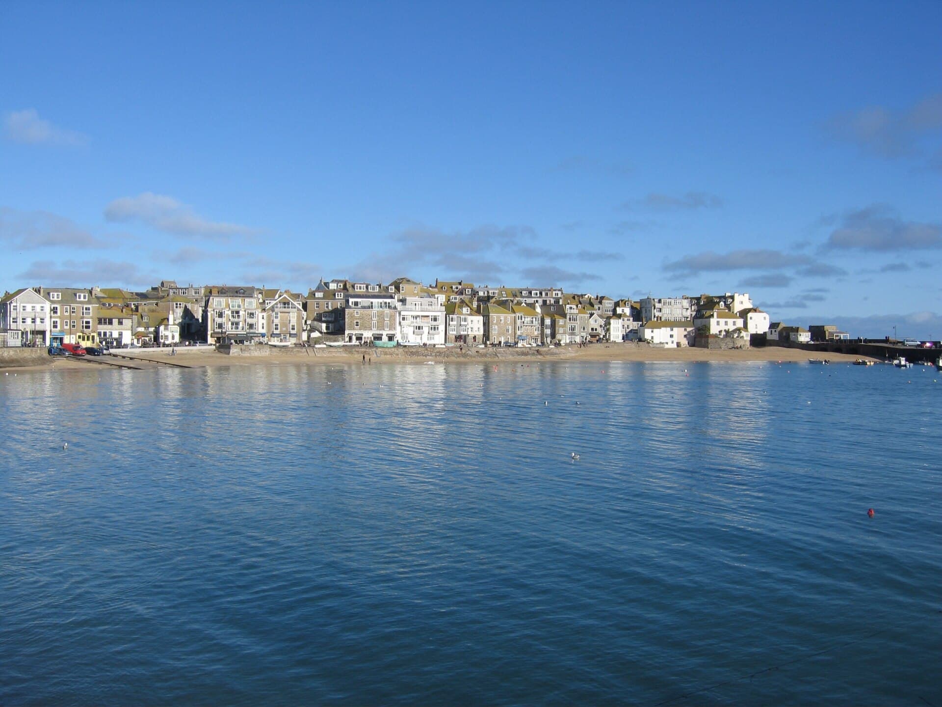 Fishing boats and sandy beach in St Ives harbour, Cornwall