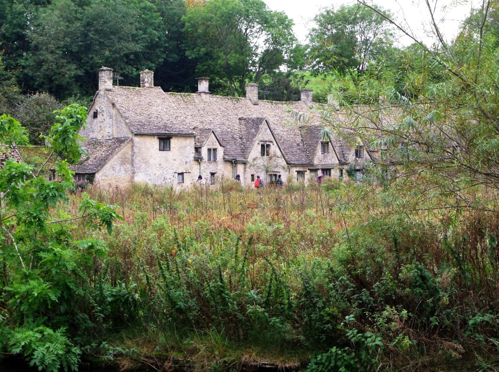 Honey-coloured stone cottages along Arlington Row in the Cotswolds