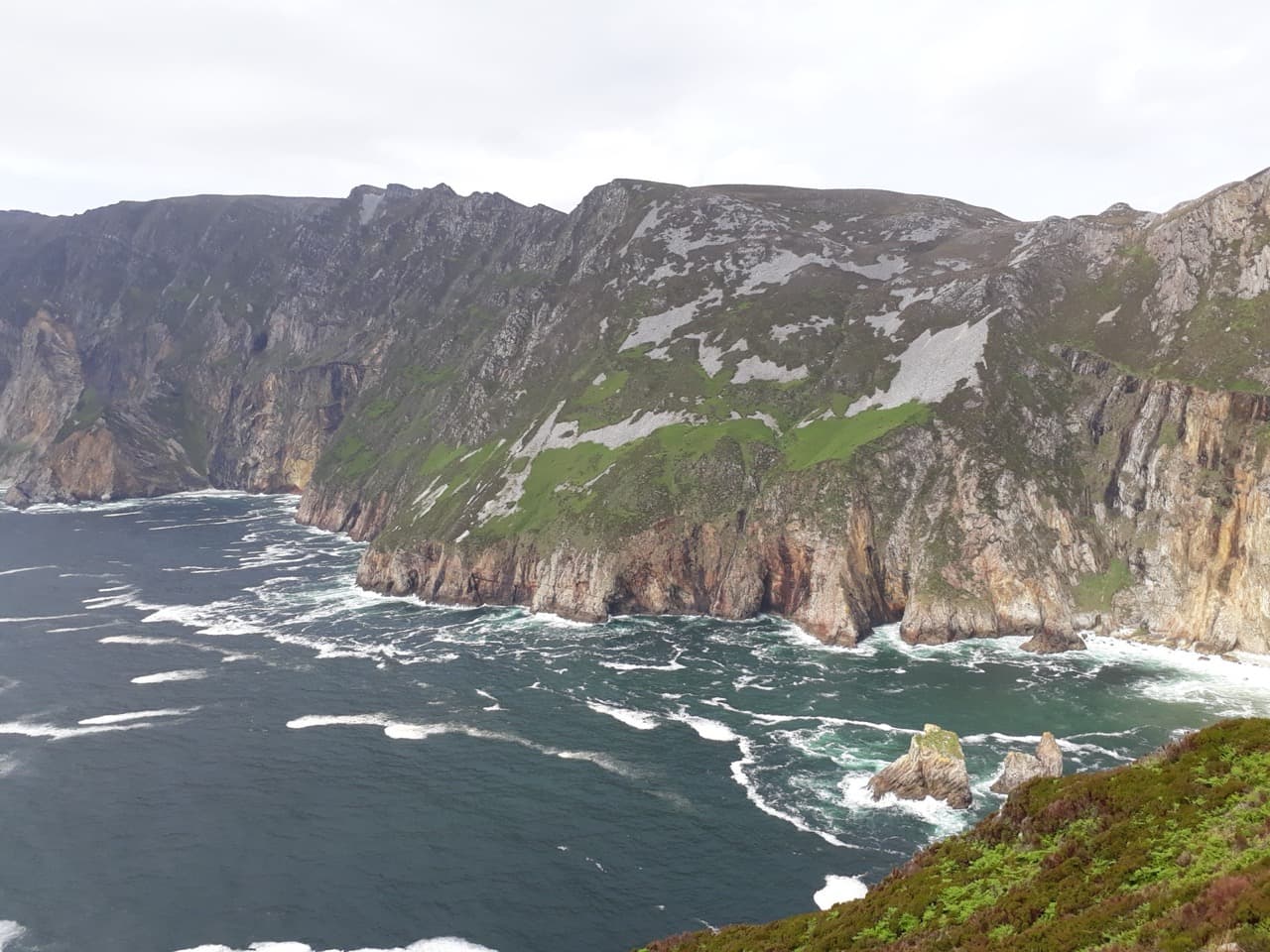 The colossal 600-metre sea cliffs of Slieve League dropping dramatically into the foaming Atlantic in south County Donegal