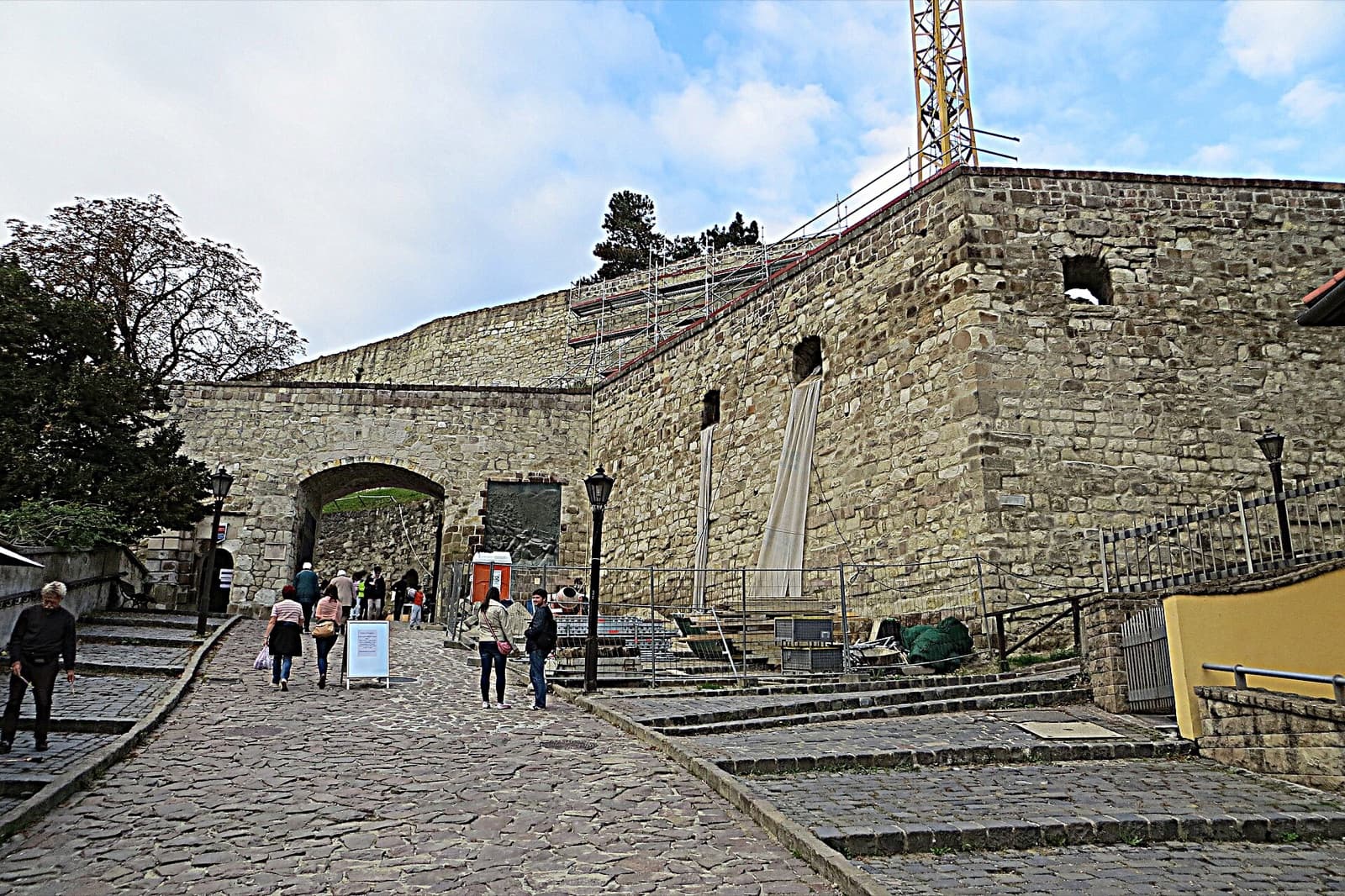The medieval stone fortress walls of Eger Castle overlooking red tiled rooftops and church spires