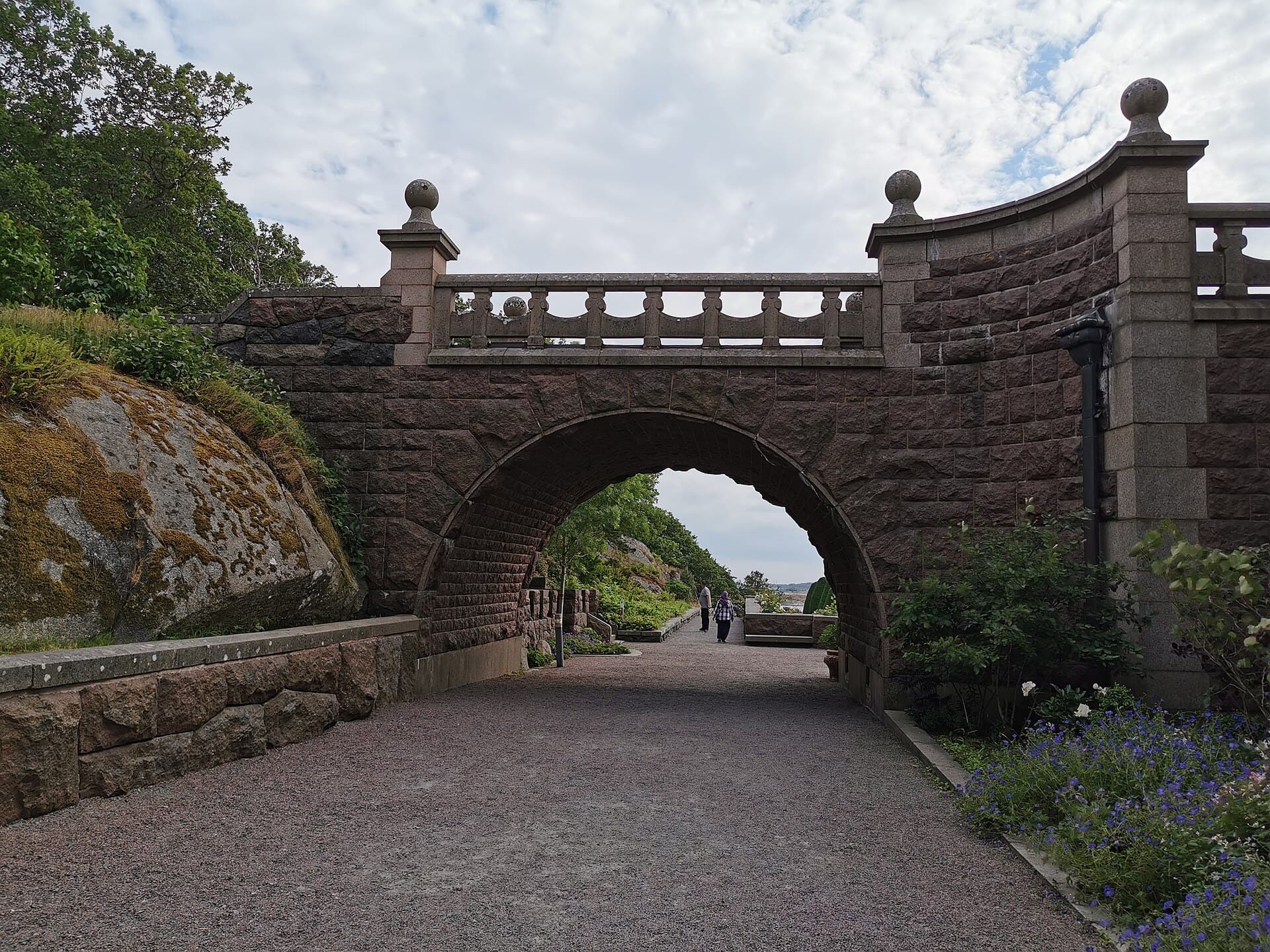 Tudor-style granite towers and manicured seaside lawns of Tjolöholm Castle on the coast of Halland