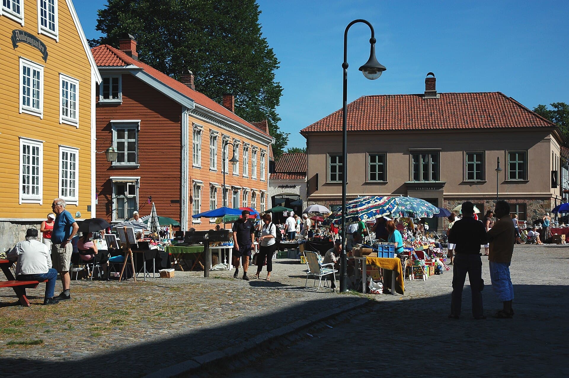 Historic cobblestones, market stalls and timber houses inside Gamlebyen, Fredrikstad.