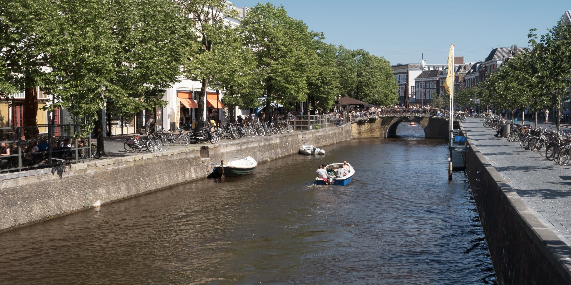 Canal quayside along the Nieuwestad with historic gabled houses in Leeuwarden