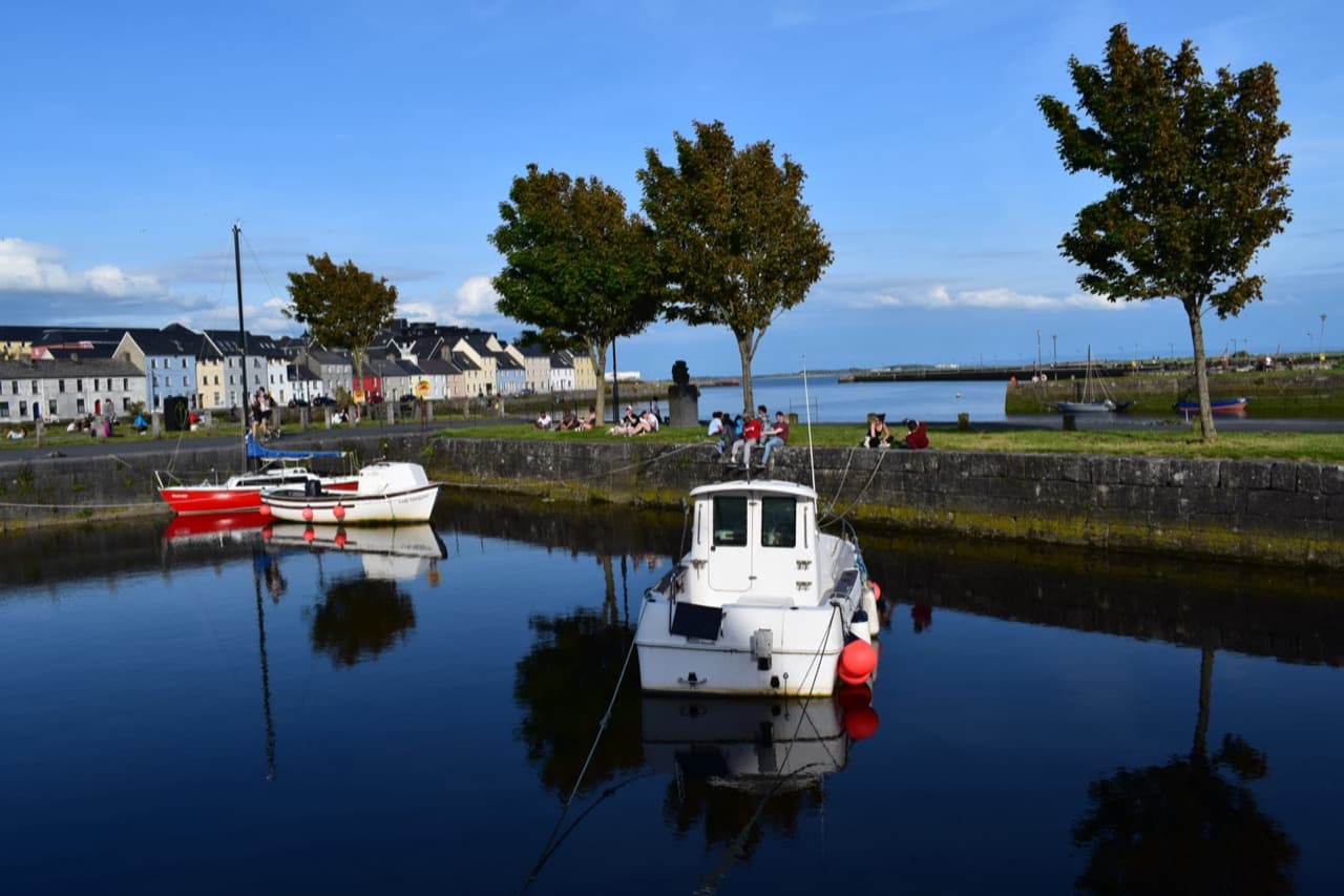 Colourful historic houses along the Long Walk in Galway overlooking the Corrib river mouth