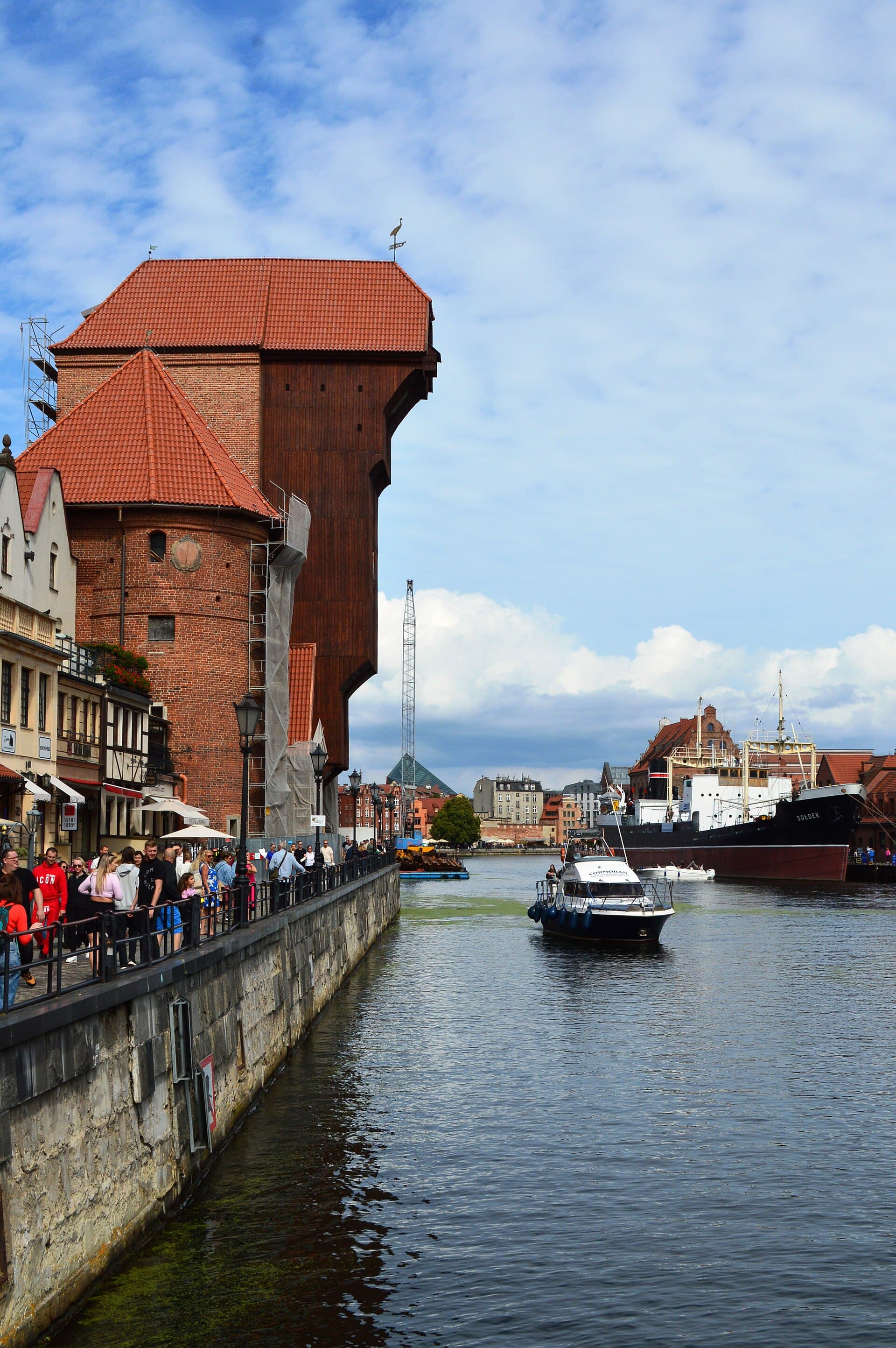 The medieval crane Zuraw and historic waterfront along the Motława River in Gdańsk