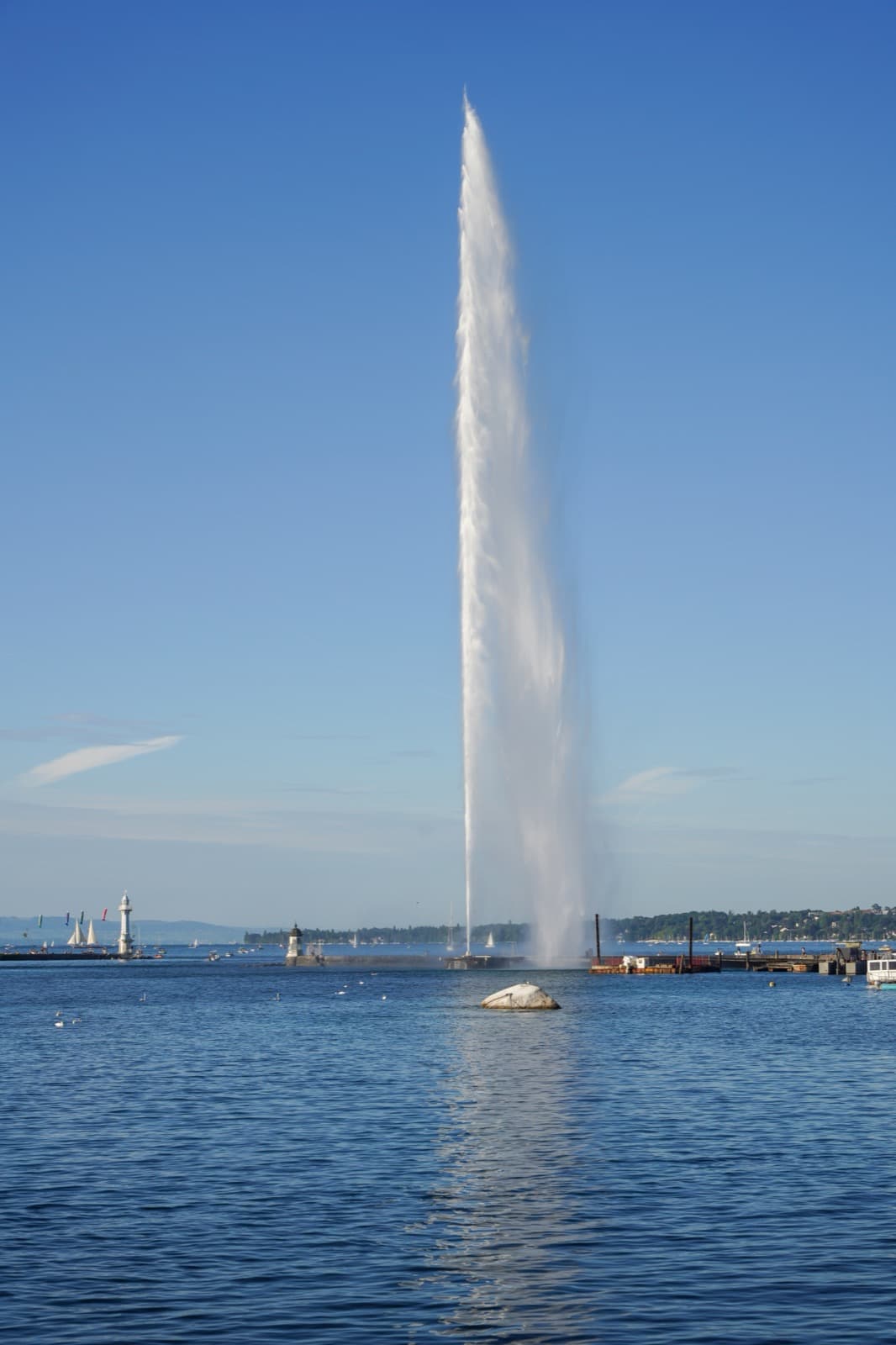 The Jet d'Eau fountain spraying into the sky across Lake Geneva