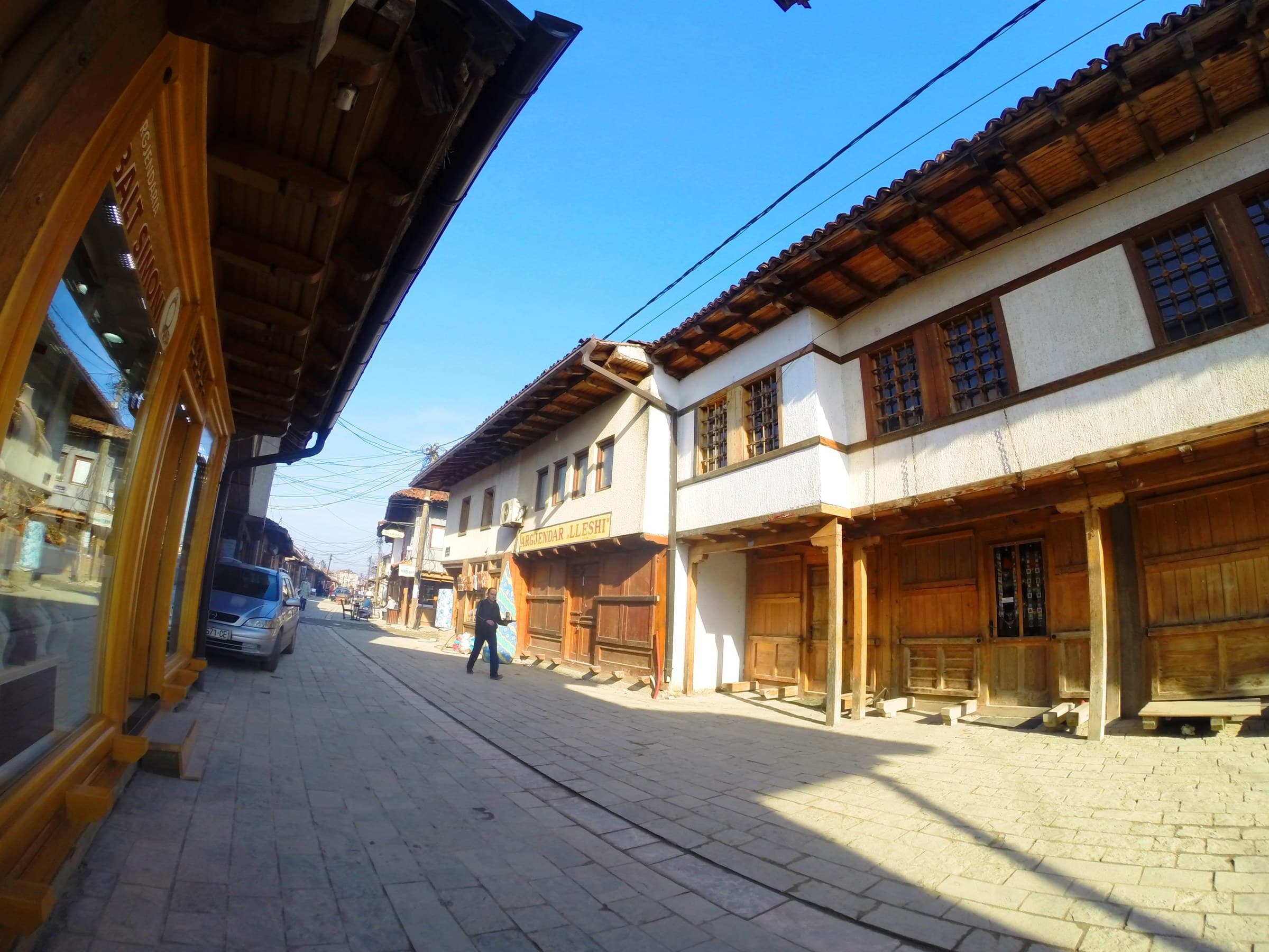 Timber shopfronts and cobbles of the rebuilt Grand Bazaar in Gjakova
