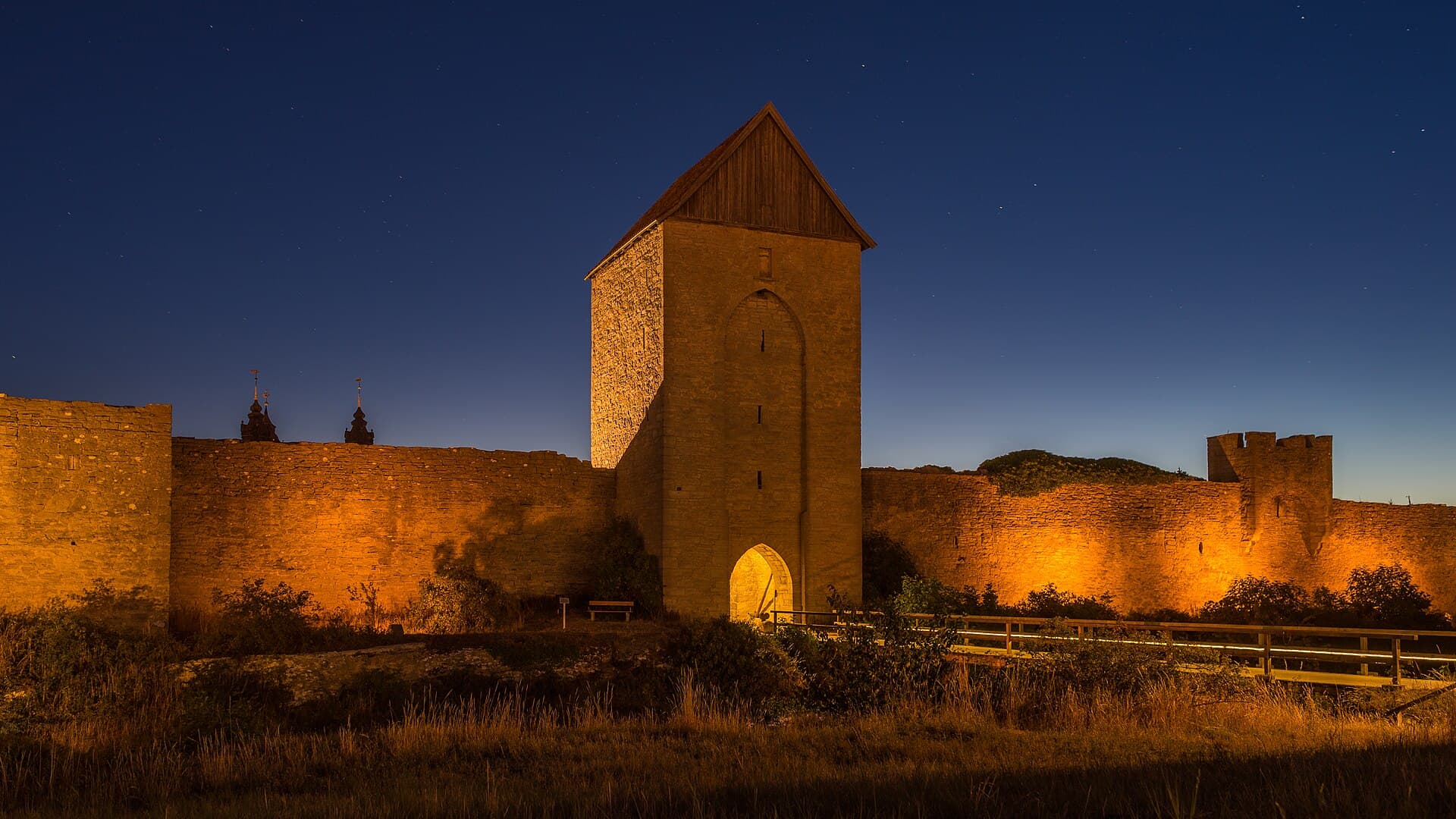 Medieval limestone towers of Visby city wall overlooking the Baltic Sea on Gotland