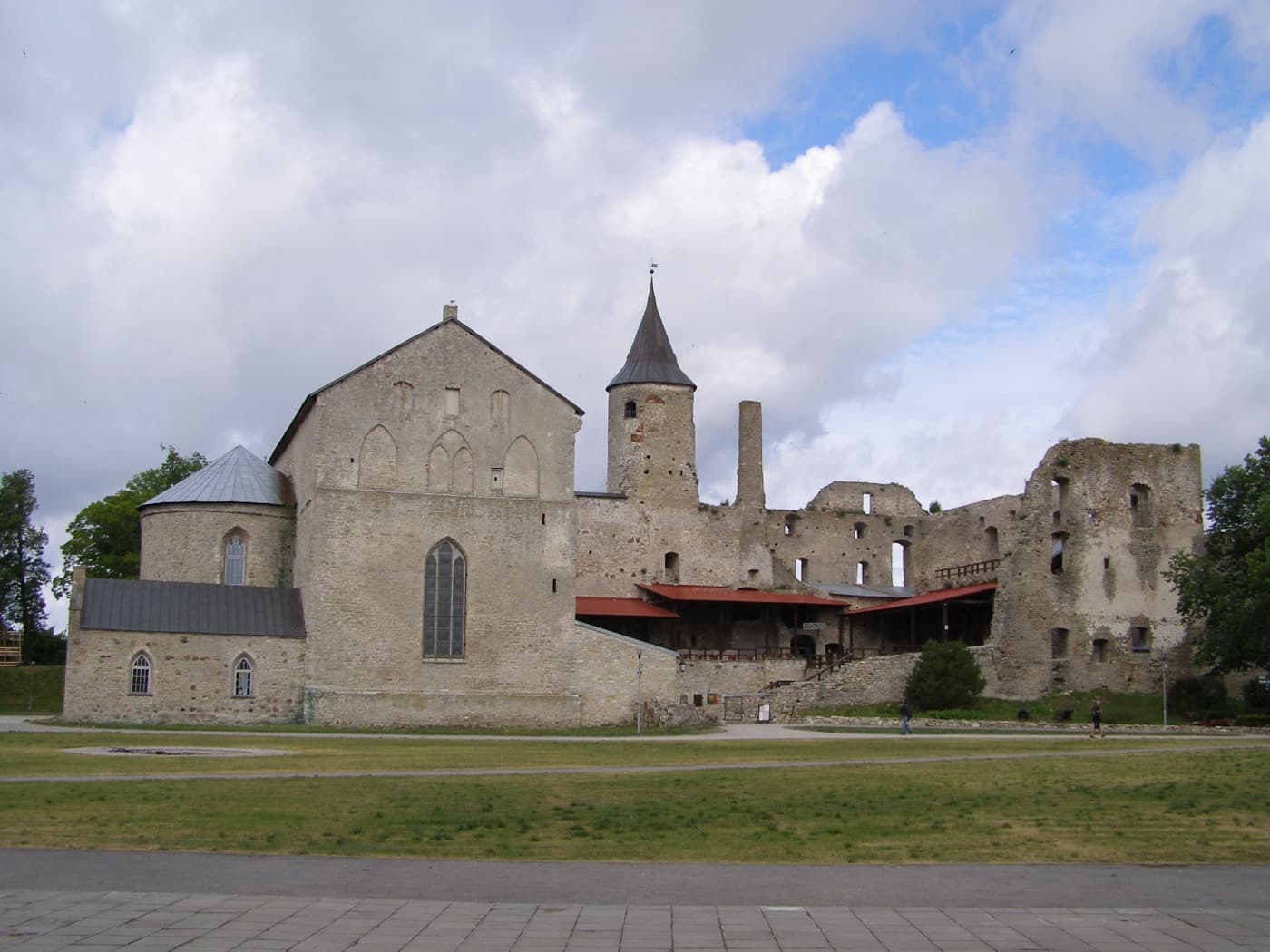 The ancient stone towers and walls of Haapsalu Episcopal Castle bathed in summer afternoon sun