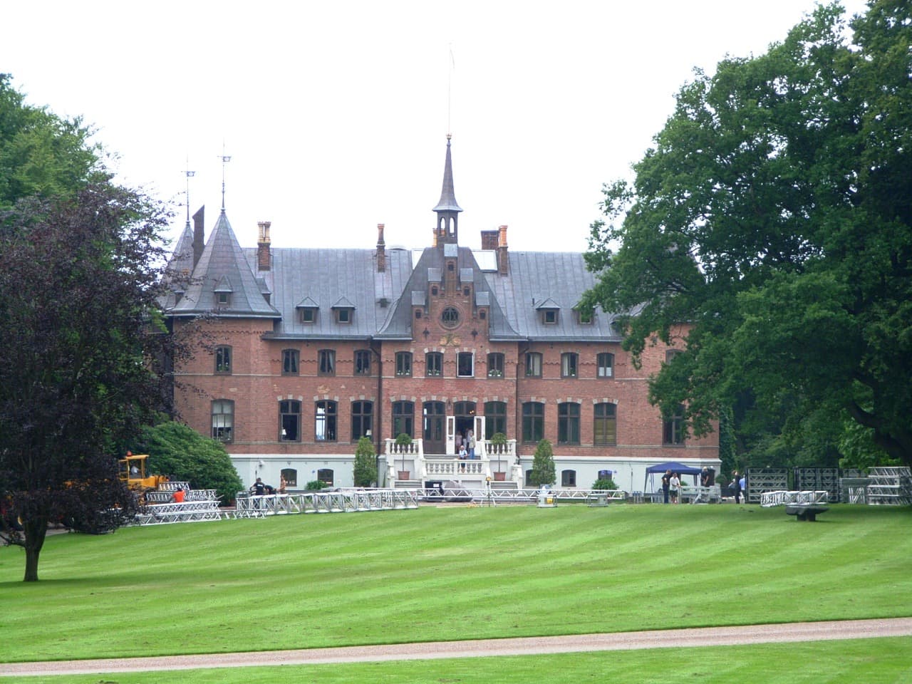 Towers of Sofiero Palace framed by flowering rhododendron gardens overlooking the Öresund strait