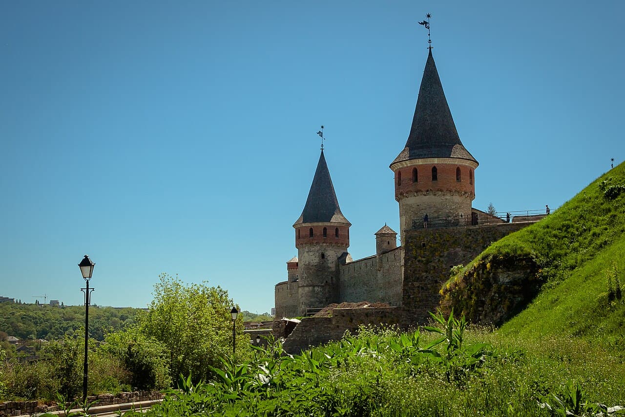 Towers of Kamianets-Podilskyi Fortress above the canyon
