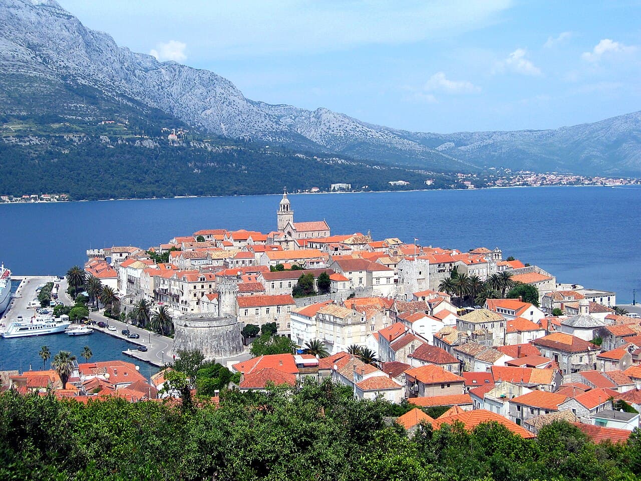 The medieval walled peninsula of Korčula Town projecting into the Adriatic channel