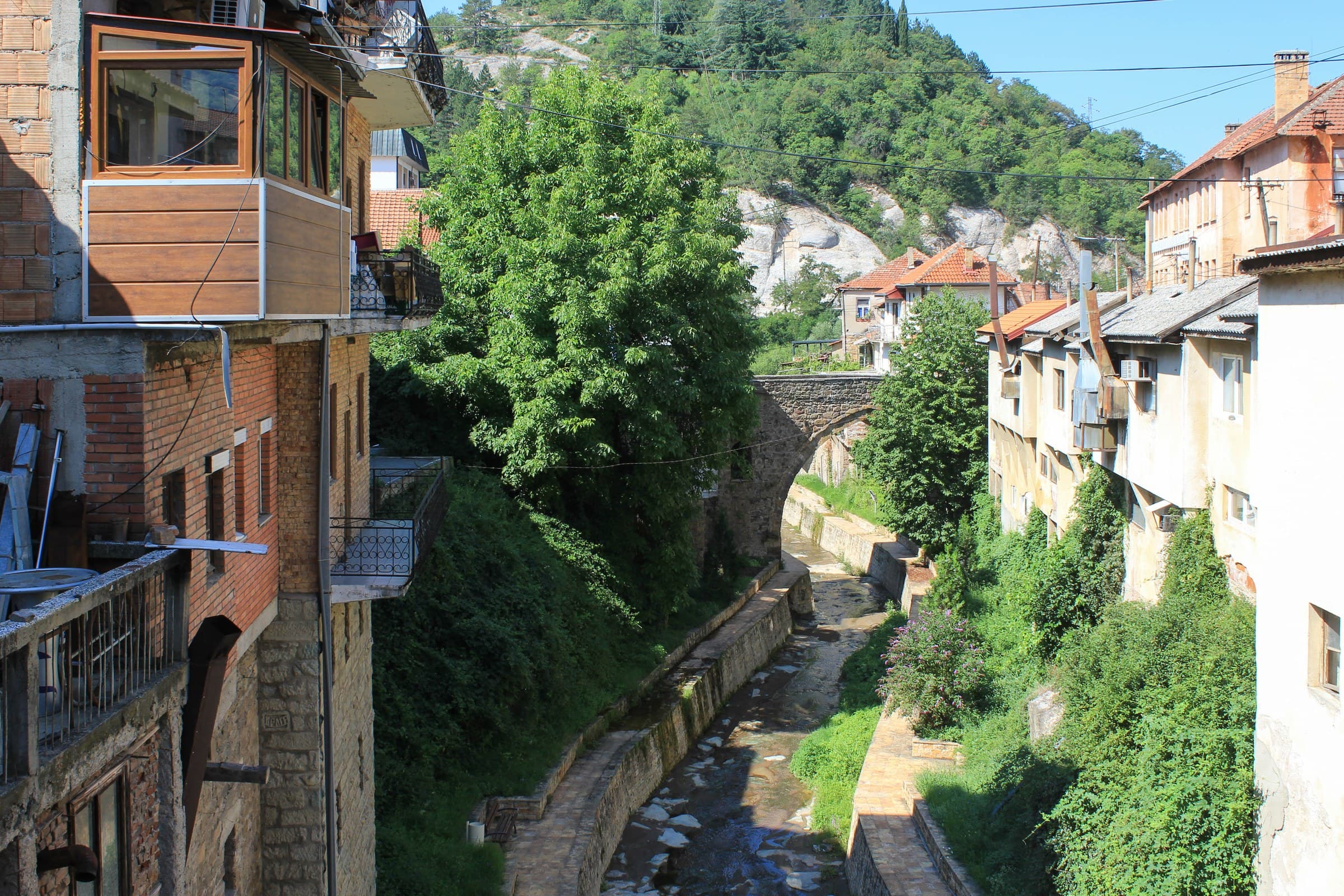 Stone tower and arched bridge over the ravine in the old town of Kratovo