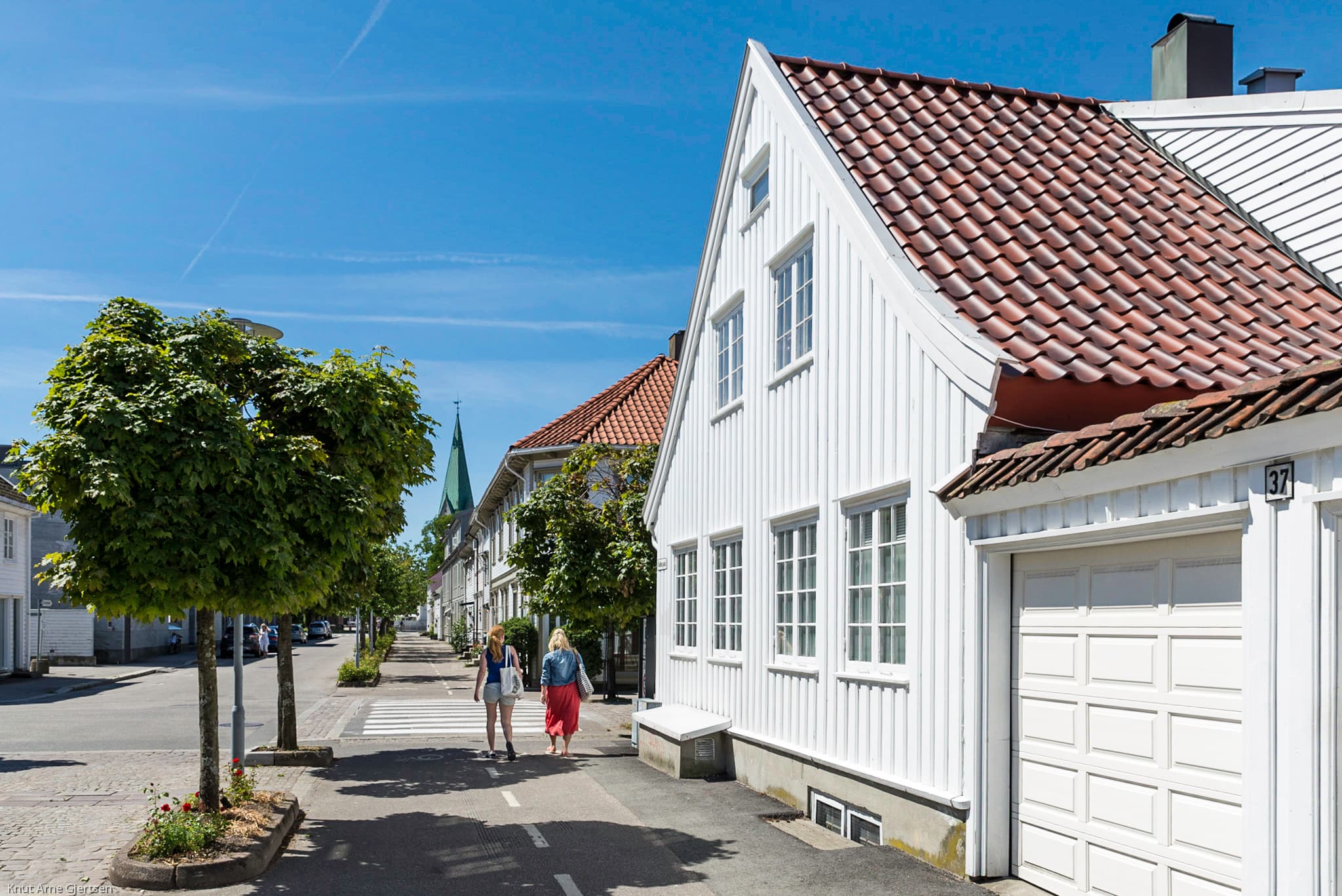 White wooden cottages and cobbled lanes in historic Posebyen, Kristiansand.