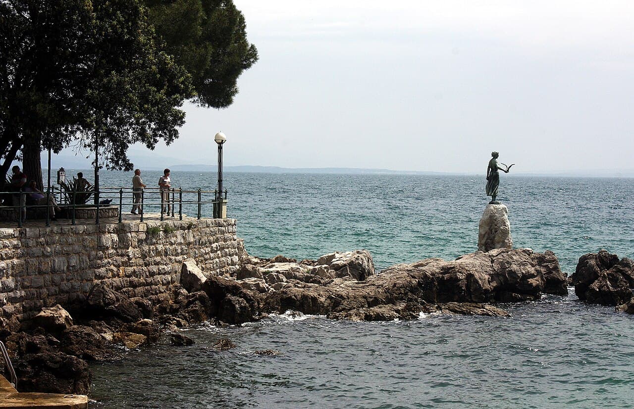 The Maiden with the Seagull bronze sculpture looking out over the Kvarner Gulf in Opatija