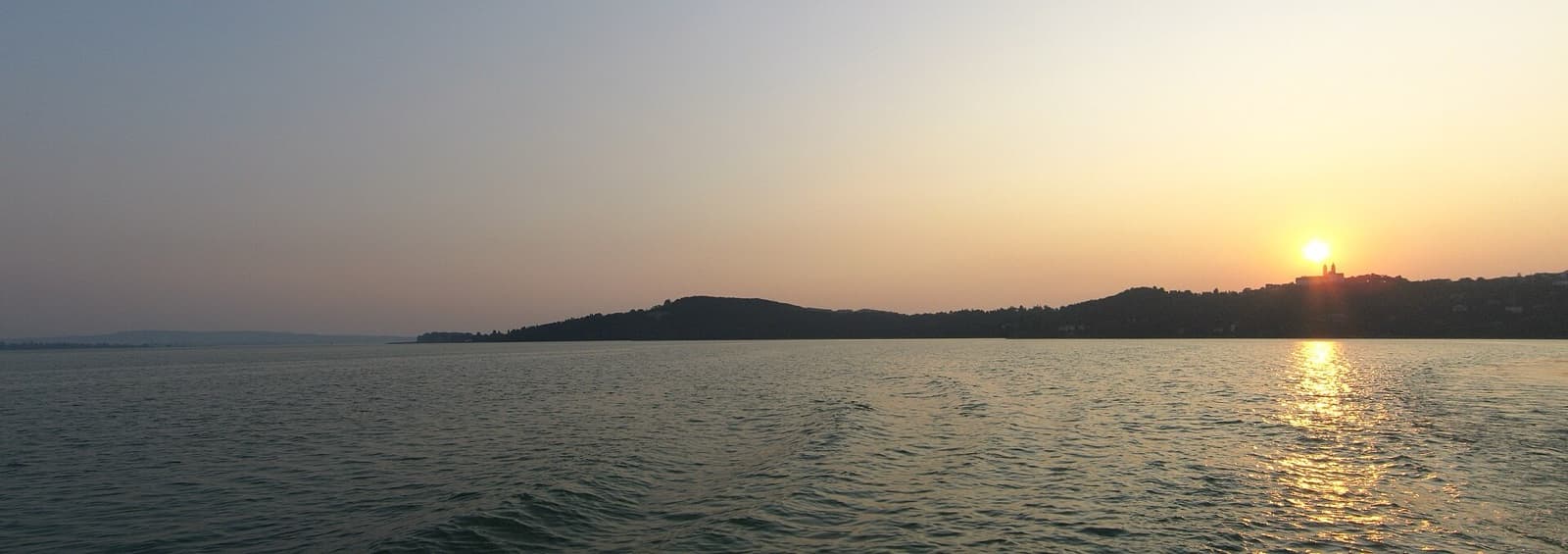 The twin-towered Benedictine Abbey of Tihany perched high above the opal waters of Lake Balaton