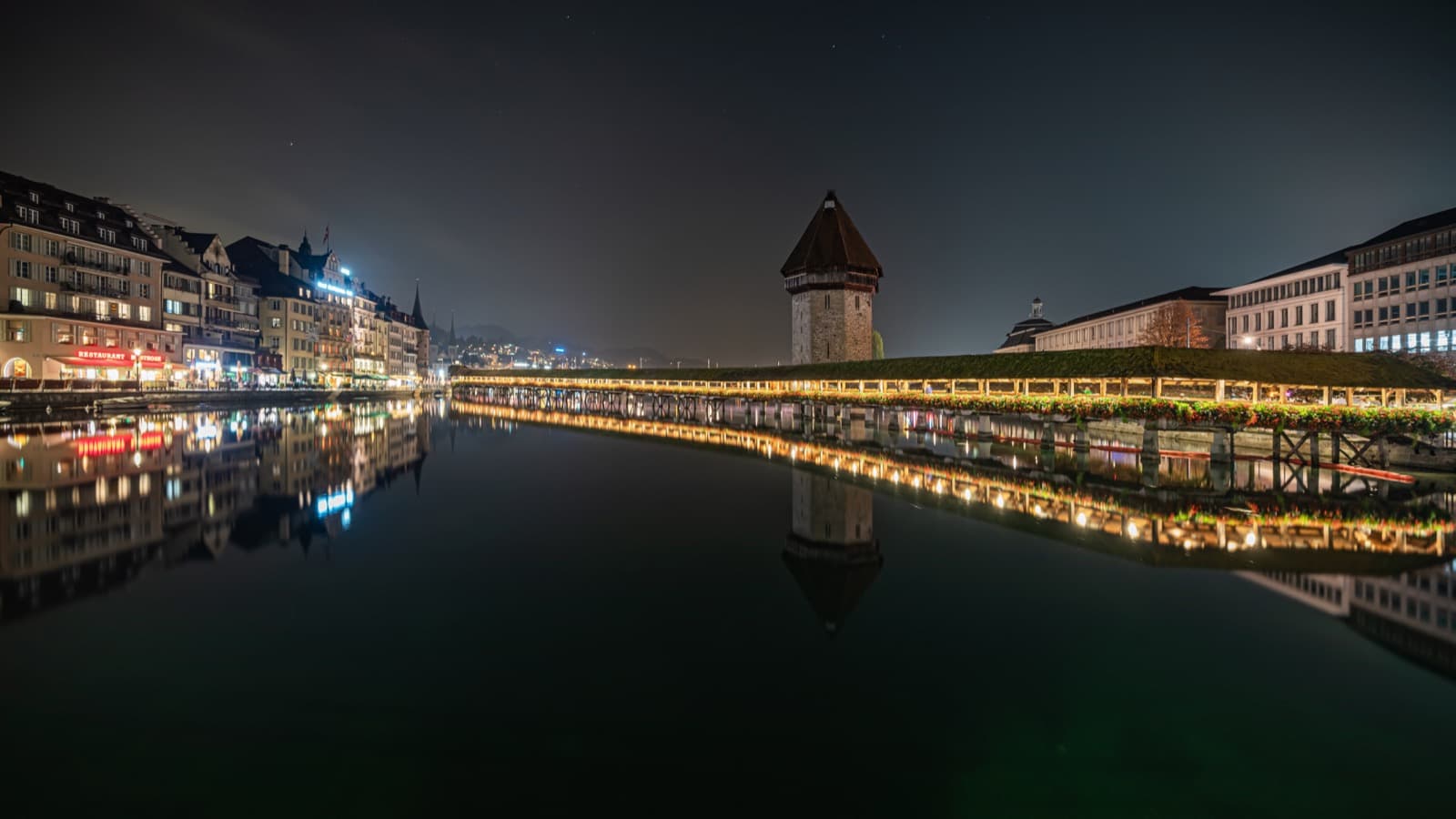 The medieval wooden Chapel Bridge (Kapellbrücke) crossing the Reuss river in Lucerne