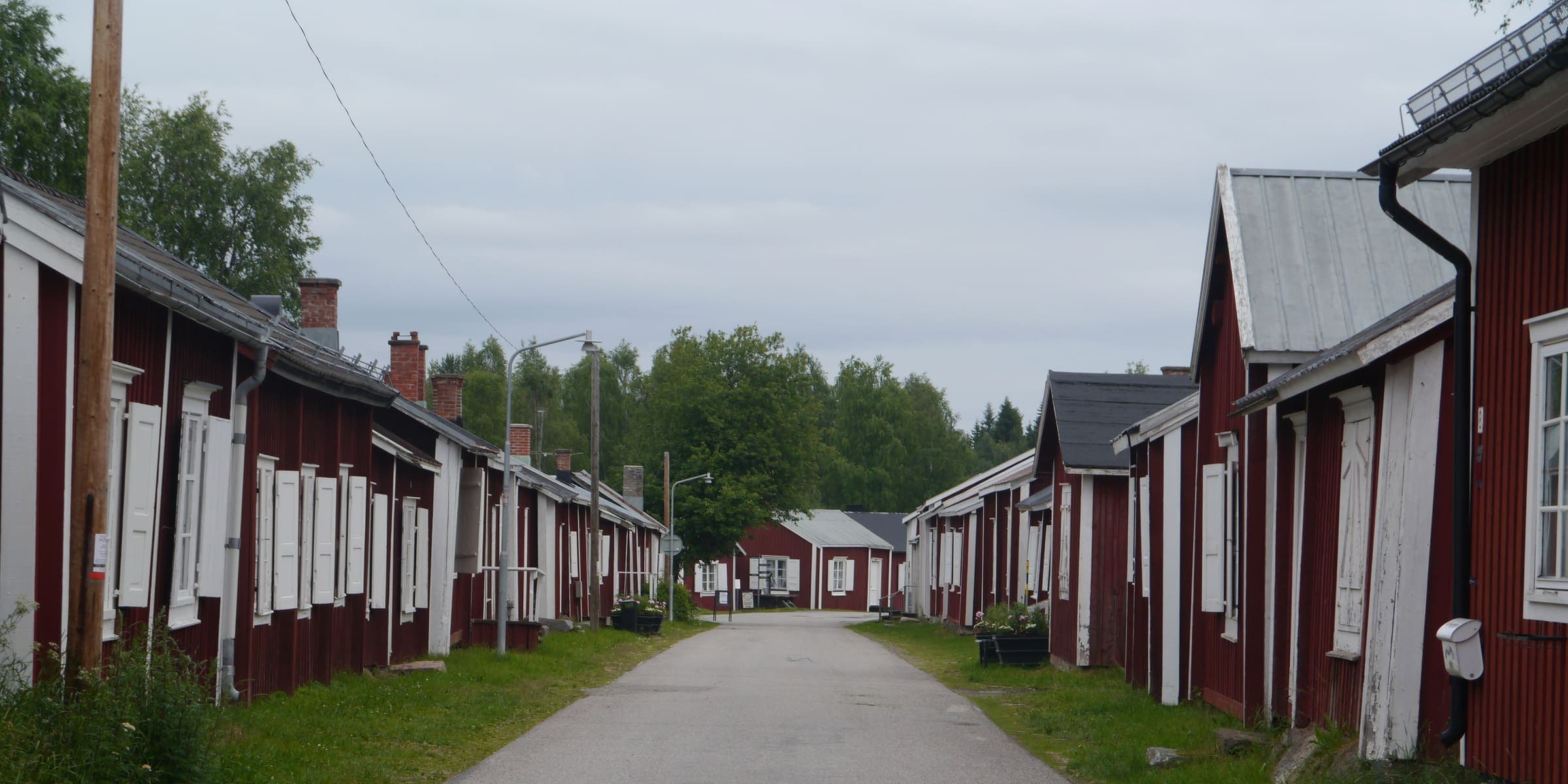 A lane of red wooden church cottages in Gammelstad Church Town