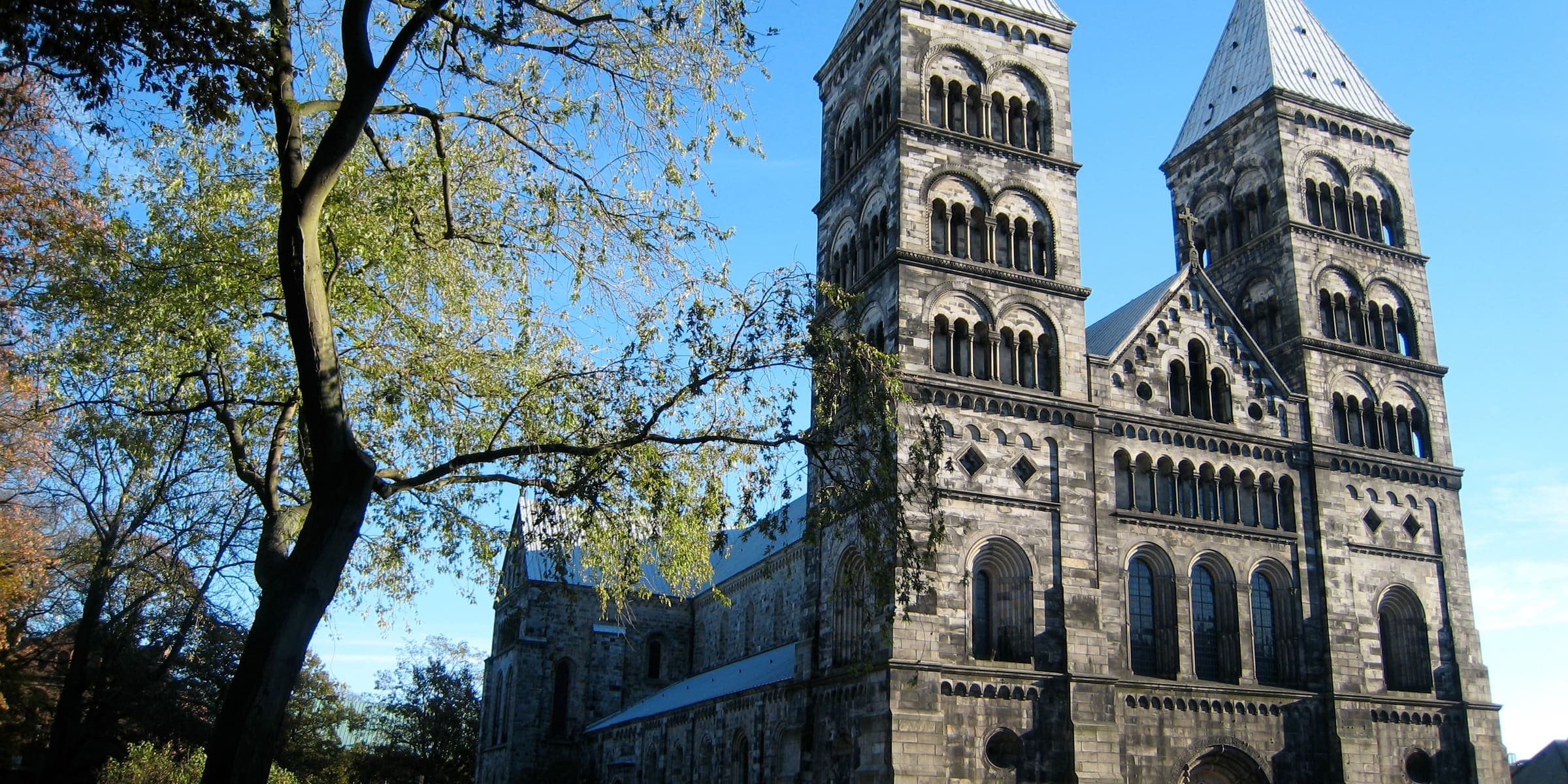 The twin towers of Lund Cathedral above the trees of Lundagård