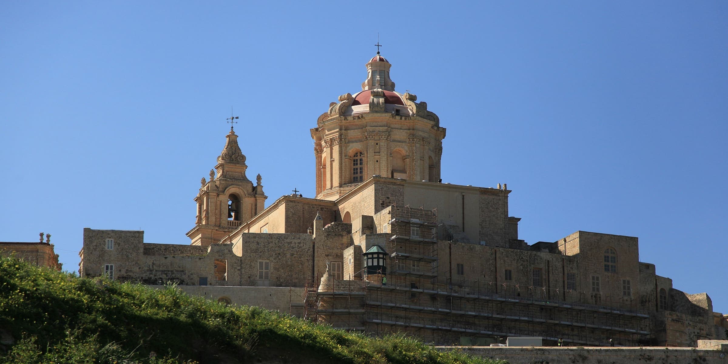 The dome and bell towers of St Paul's Cathedral rising over the walls of Mdina