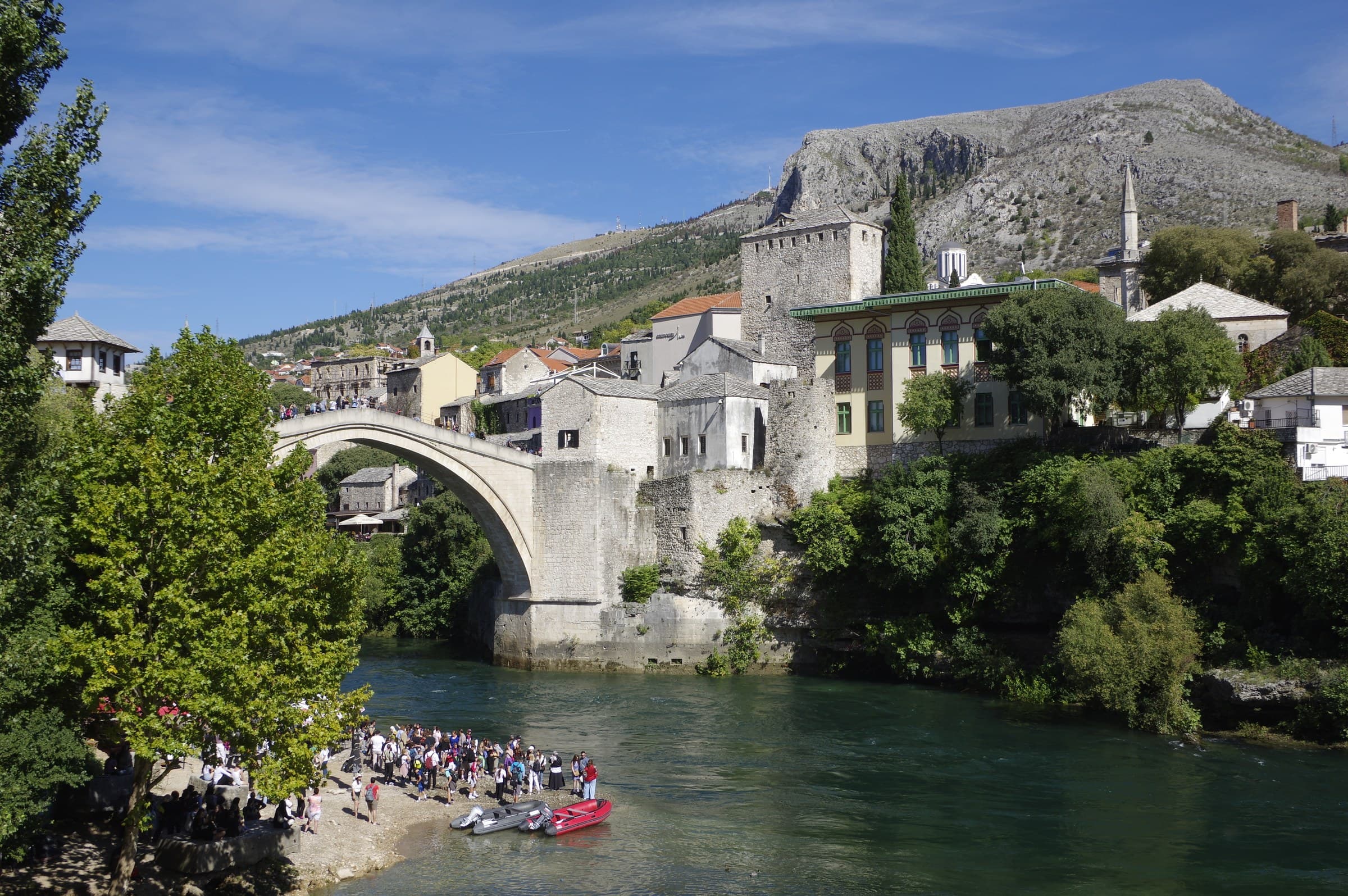 Stari Most stone arch bridge spanning the turquoise Neretva River in historic Mostar