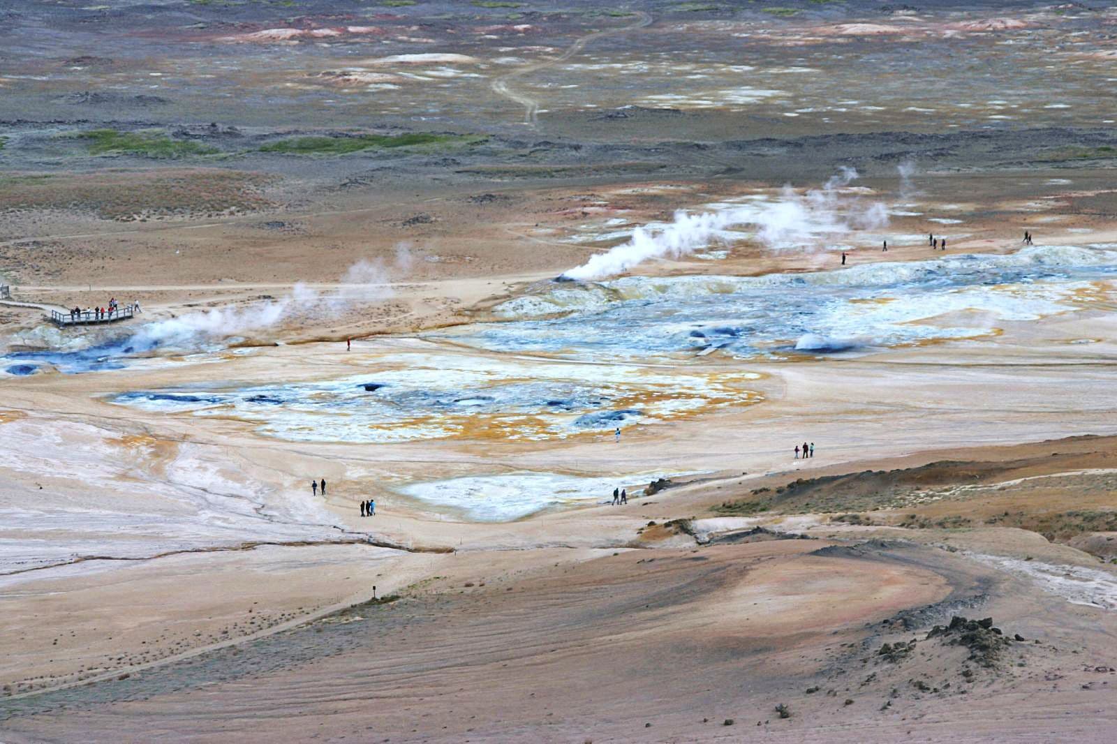 Steaming volcanic fumaroles and boiling mud pools at Hverir geothermal area near Lake Mývatn