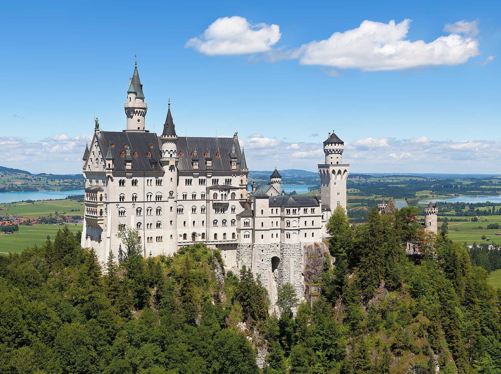 Fairytale spires of Neuschwanstein Castle set against Bavarian alpine peaks