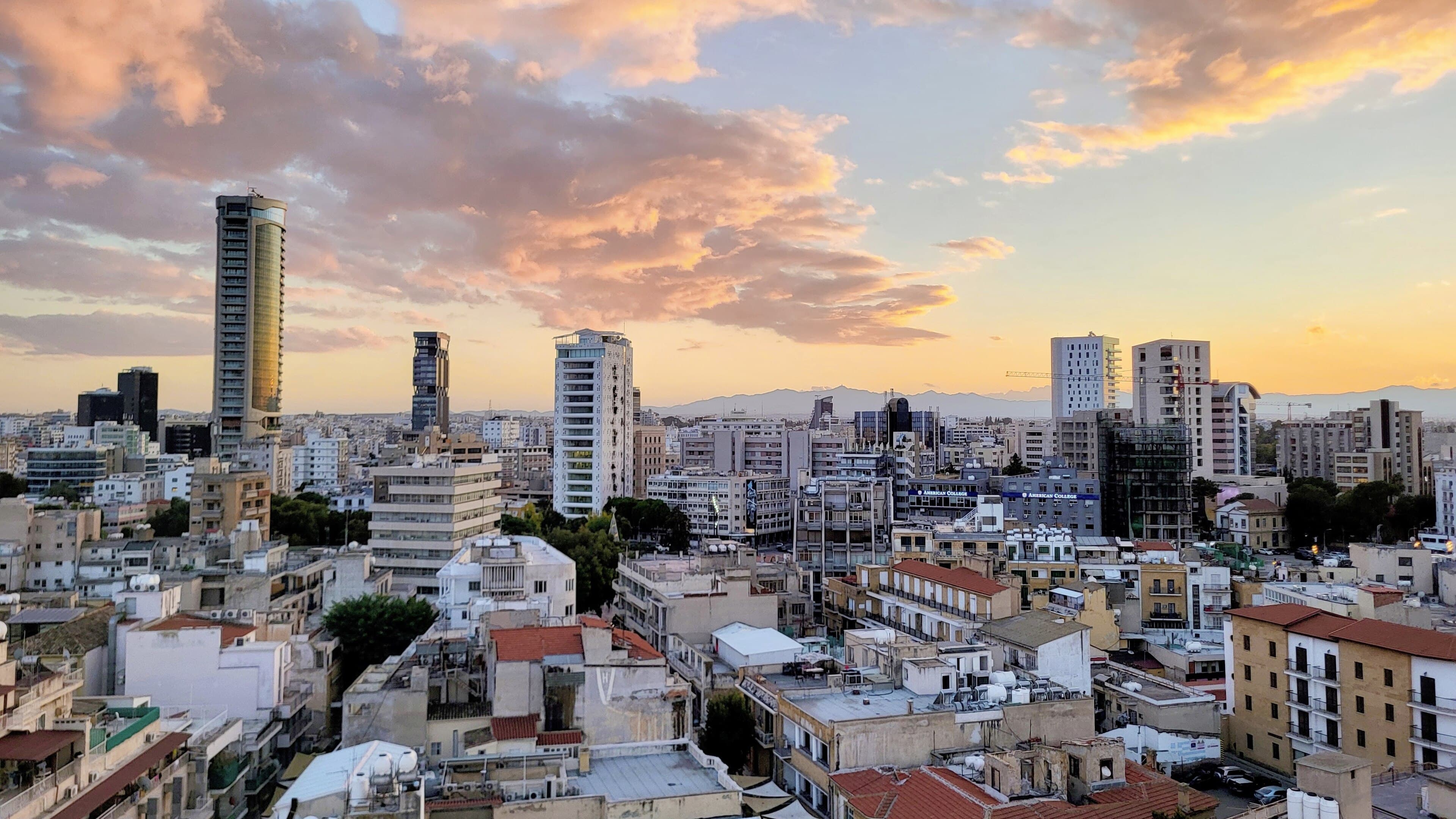 Nicosia's old rooftops and modern skyline in evening light