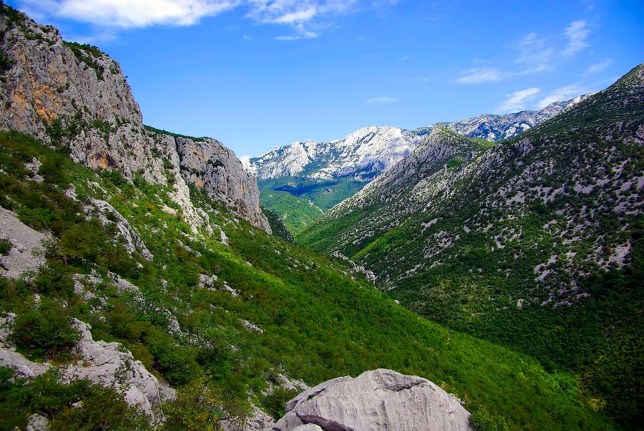 Towering limestone canyon walls and mountain gorge in Paklenica National Park