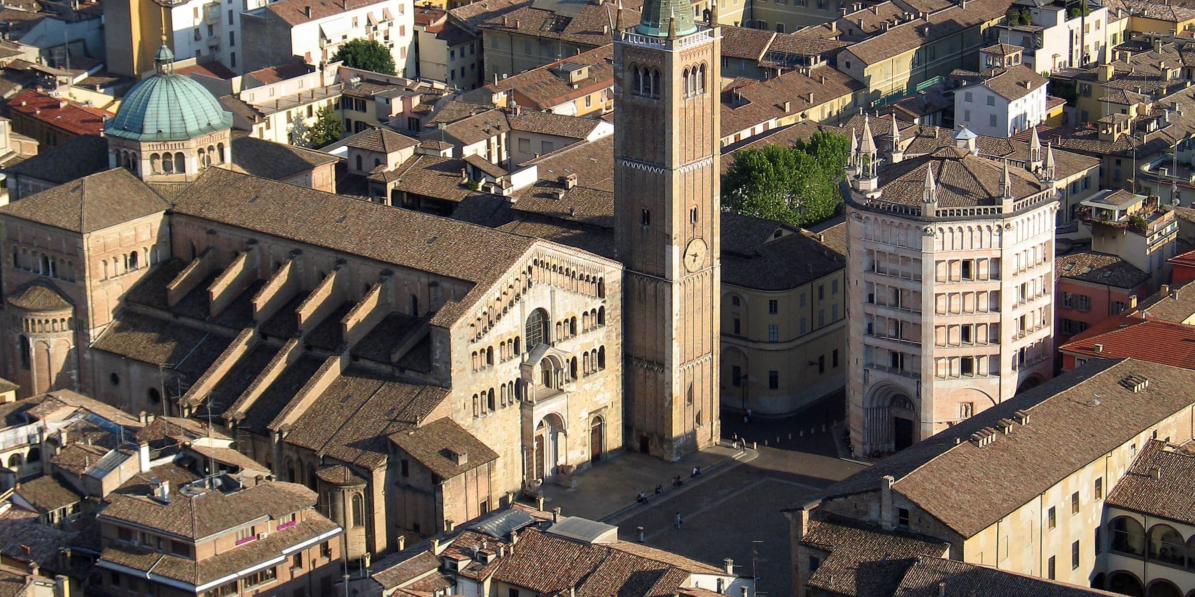 Parma Cathedral, its bell tower and the octagonal pink Baptistery from above