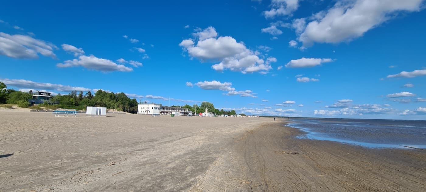 Pärnu beach with white Baltic sand, calm shallow waters and coastal dunes
