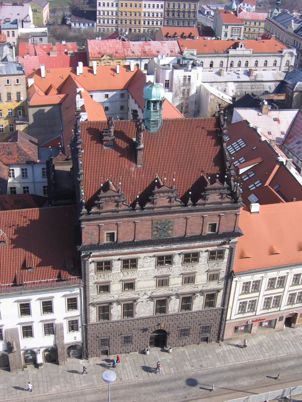 The soaring Gothic spire of St Bartholomew's Cathedral rising above Republic Square in Plzeň