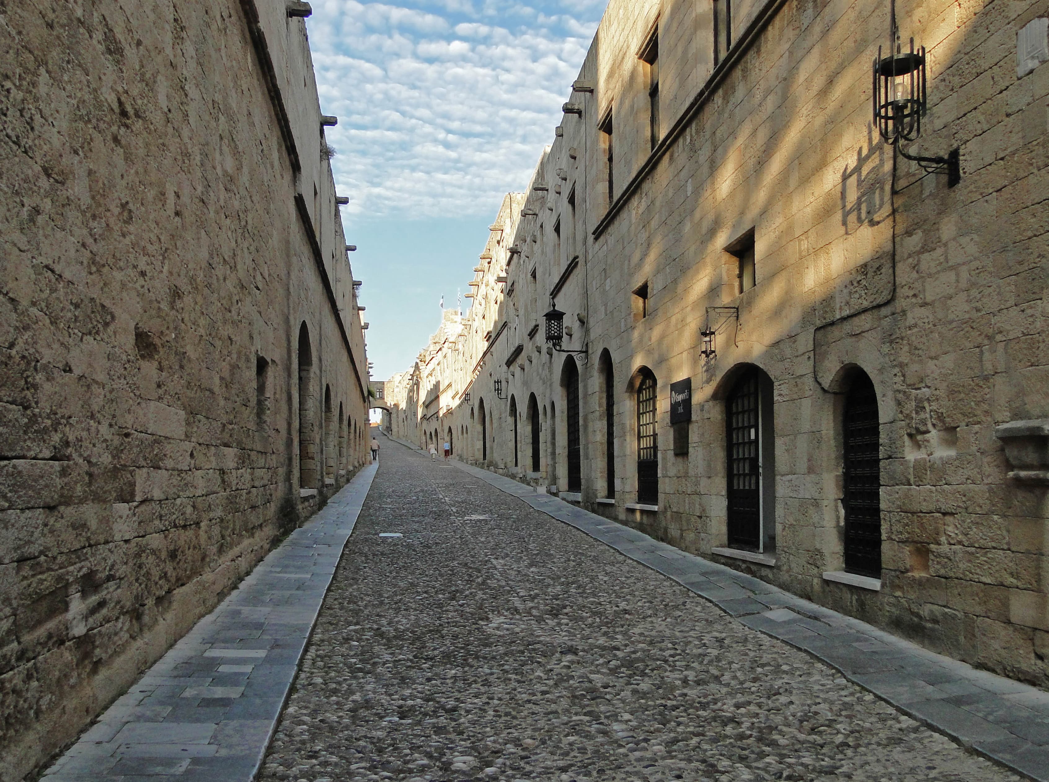 Gothic sandstone facades and arched portals along the Street of the Knights in Rhodes