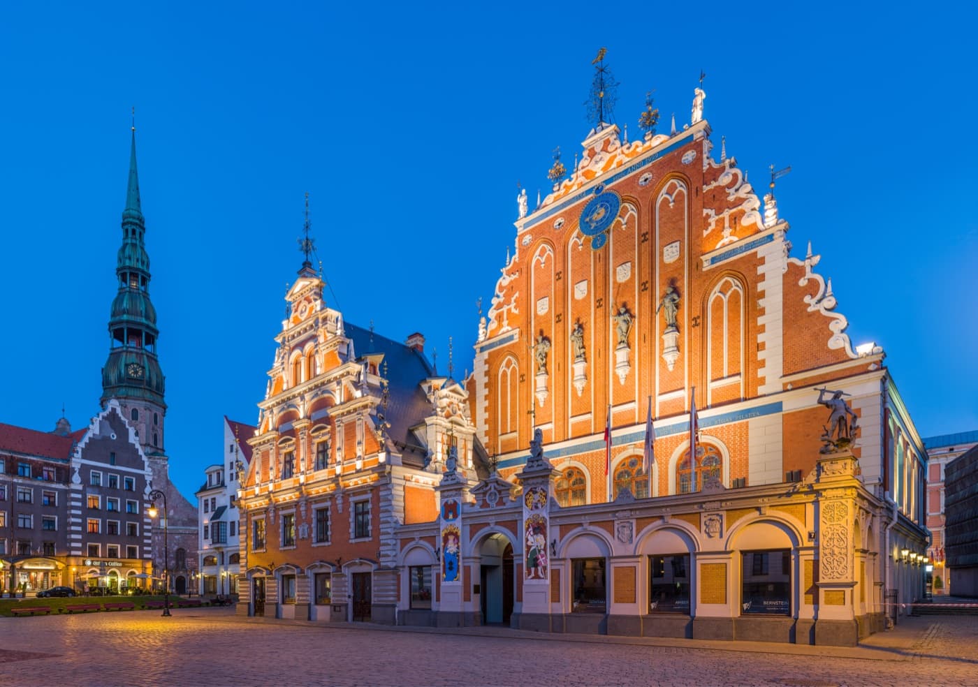 The ornate Gothic House of the Blackheads and spire of St. Peter's Church in Riga's Old Town