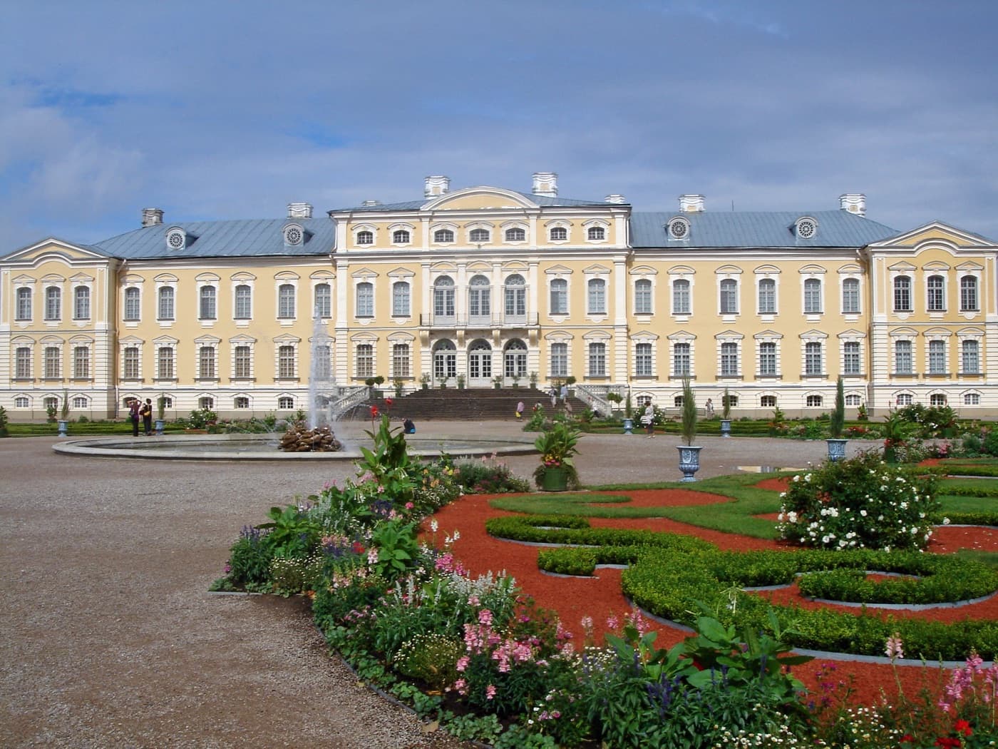 The ornate baroque facade and manicured French rose gardens of Rundāle Palace in Zemgale