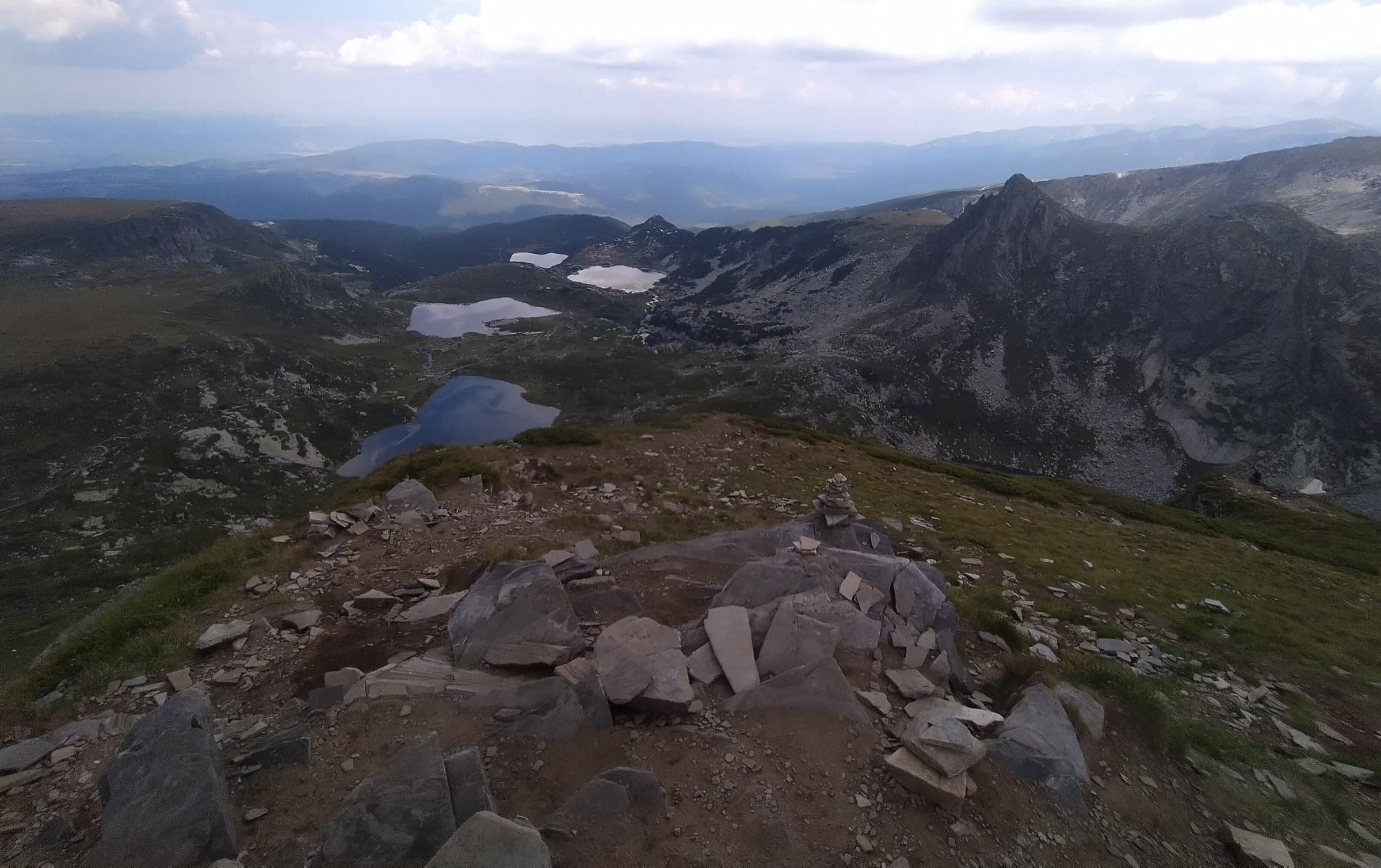 Panoramic mountain view over the stepped glacial basins of the Seven Rila Lakes beneath alpine peaks