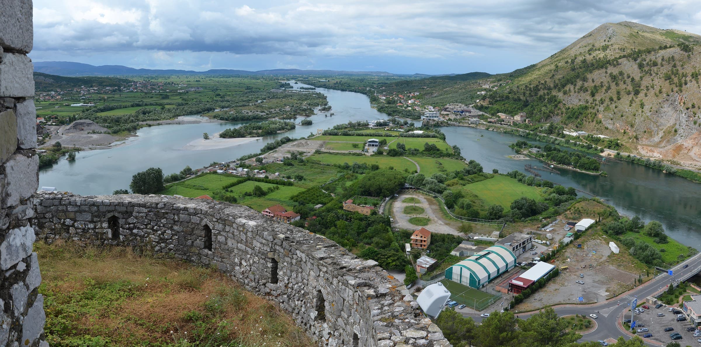 The high stone walls of Rozafa Castle overlooking the confluence of the Buna and Drin rivers in Shkodër