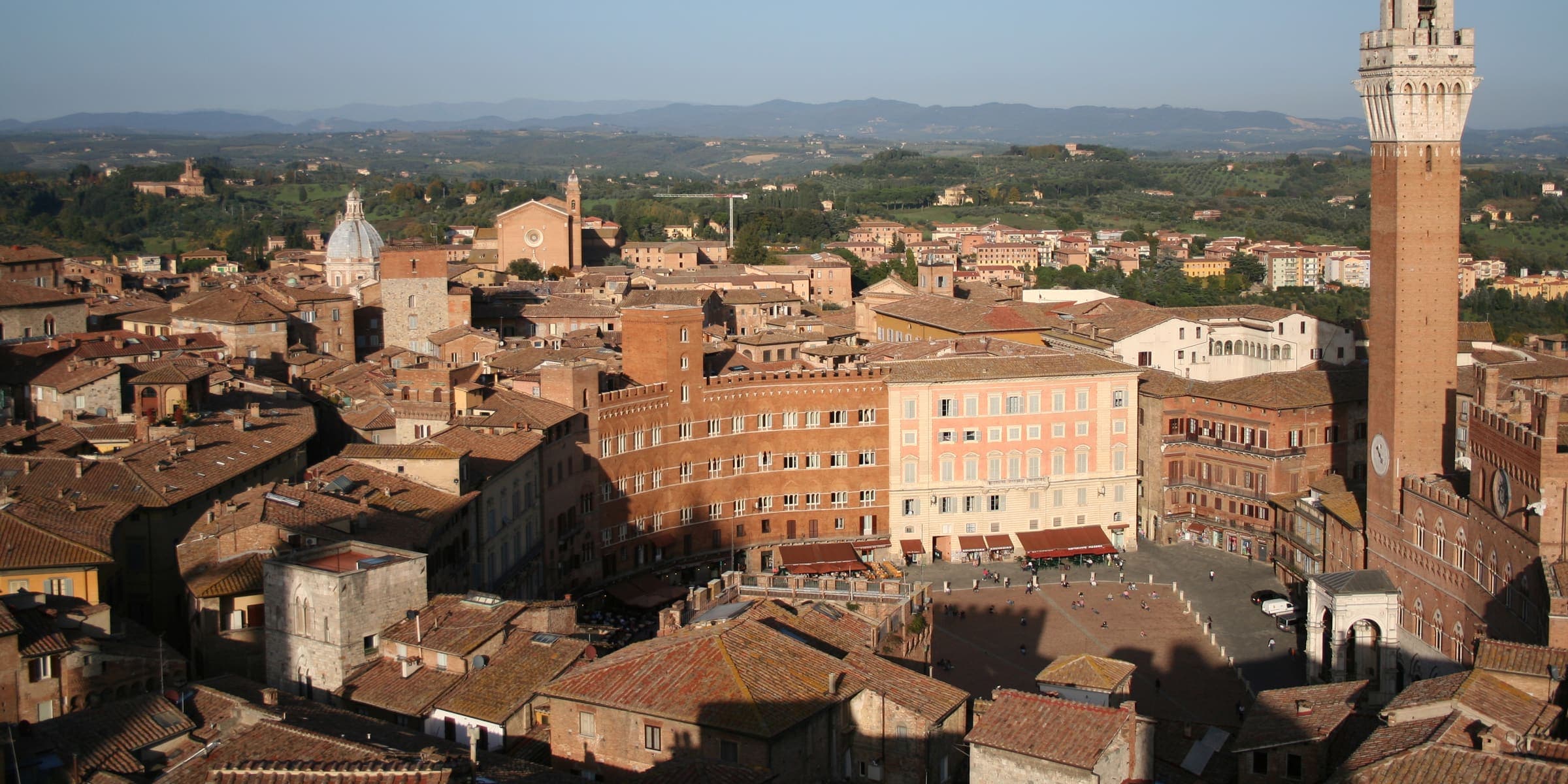 Siena's rooftops and Piazza del Campo from above, with the Torre del Mangia