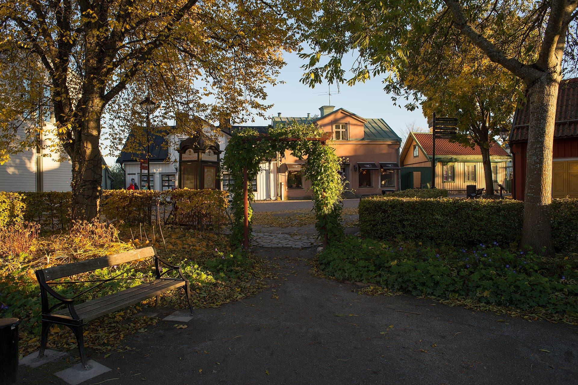 Historic pastel wooden townhouses and cobblestone streets of Stora Gatan in Sigtuna beside Lake Mälaren
