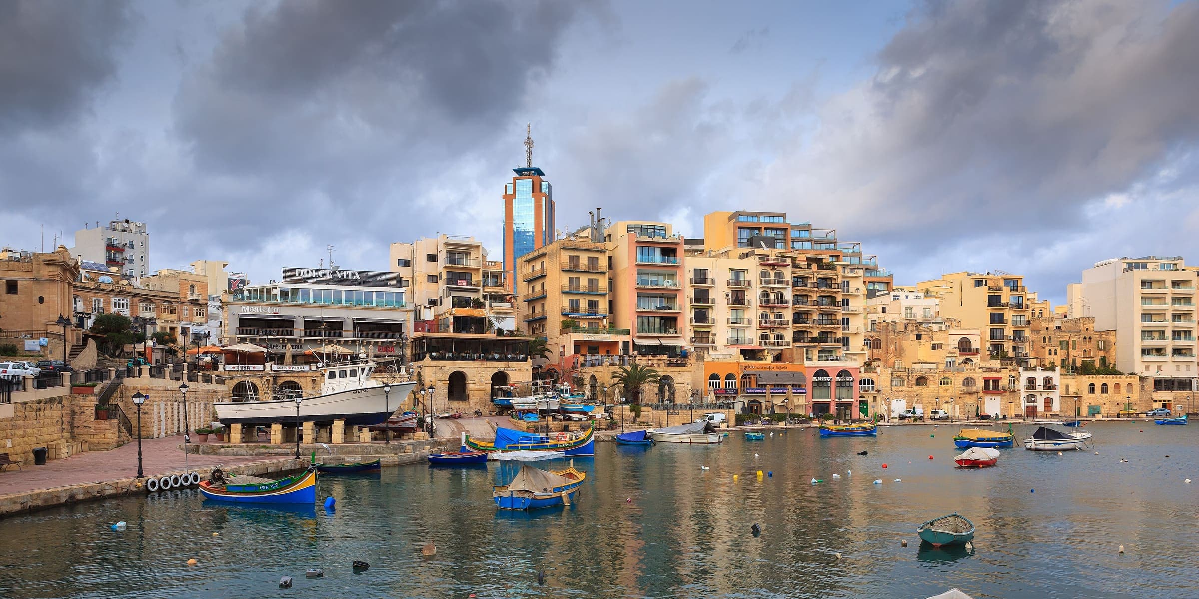 Spinola Bay in St Julian's with fishing boats and the waterfront