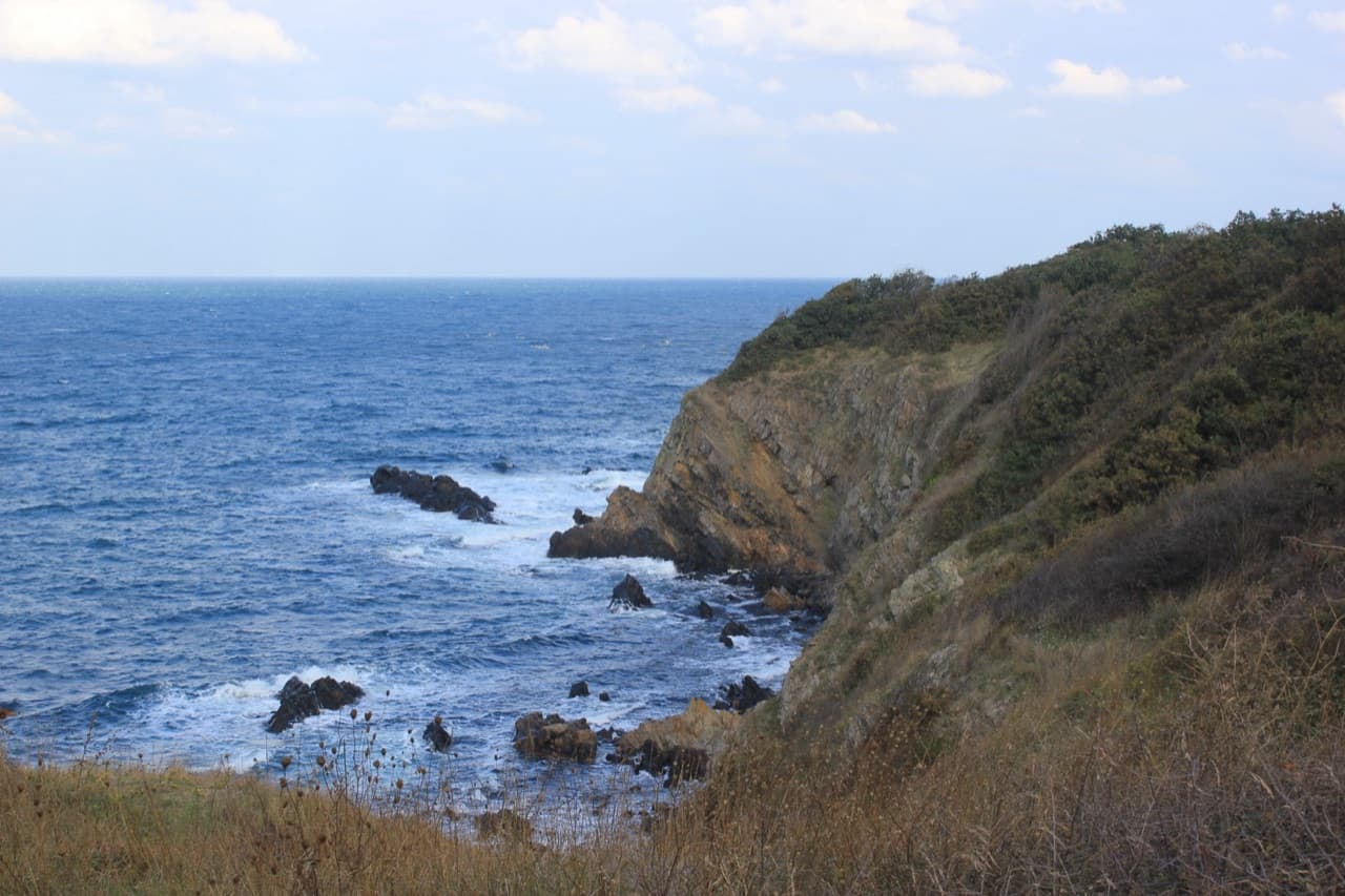 Wooden cantilevered Revival houses lining the rocky coastline and cliffs of old Sozopol above the Black Sea