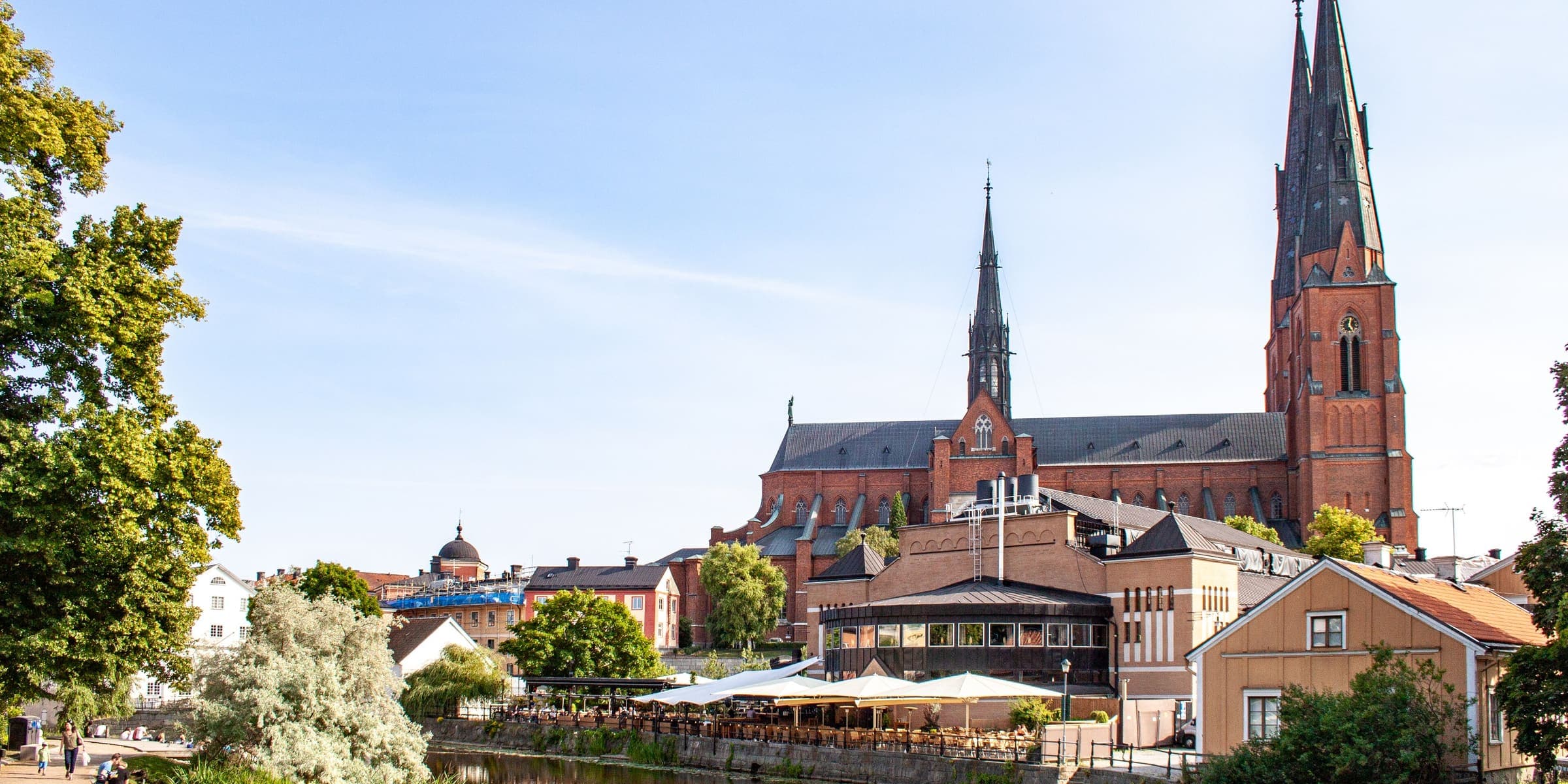 Uppsala Cathedral's twin spires above the River Fyris on a summer day