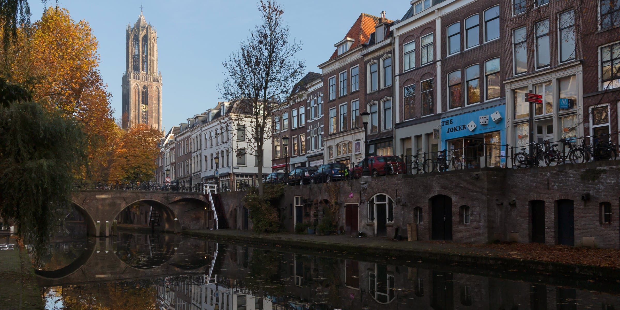 The Dom Tower rising above the sunken wharves and waters of the Oudegracht canal in Utrecht